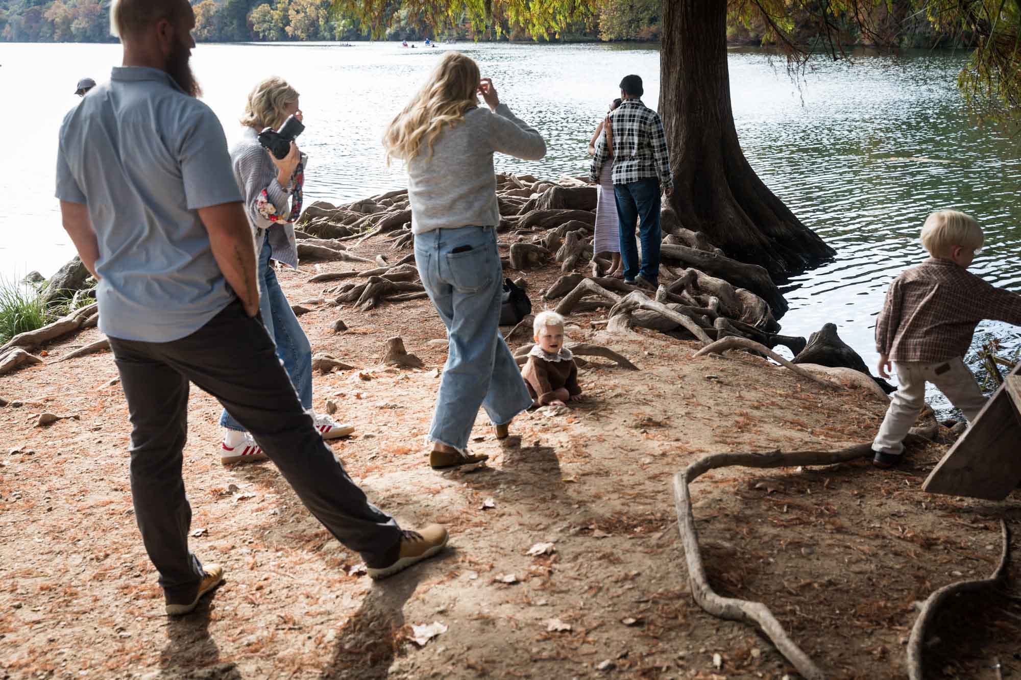 Chaotic scene of multiple photo shoots going on at the same time at the end of Red Bud Isle