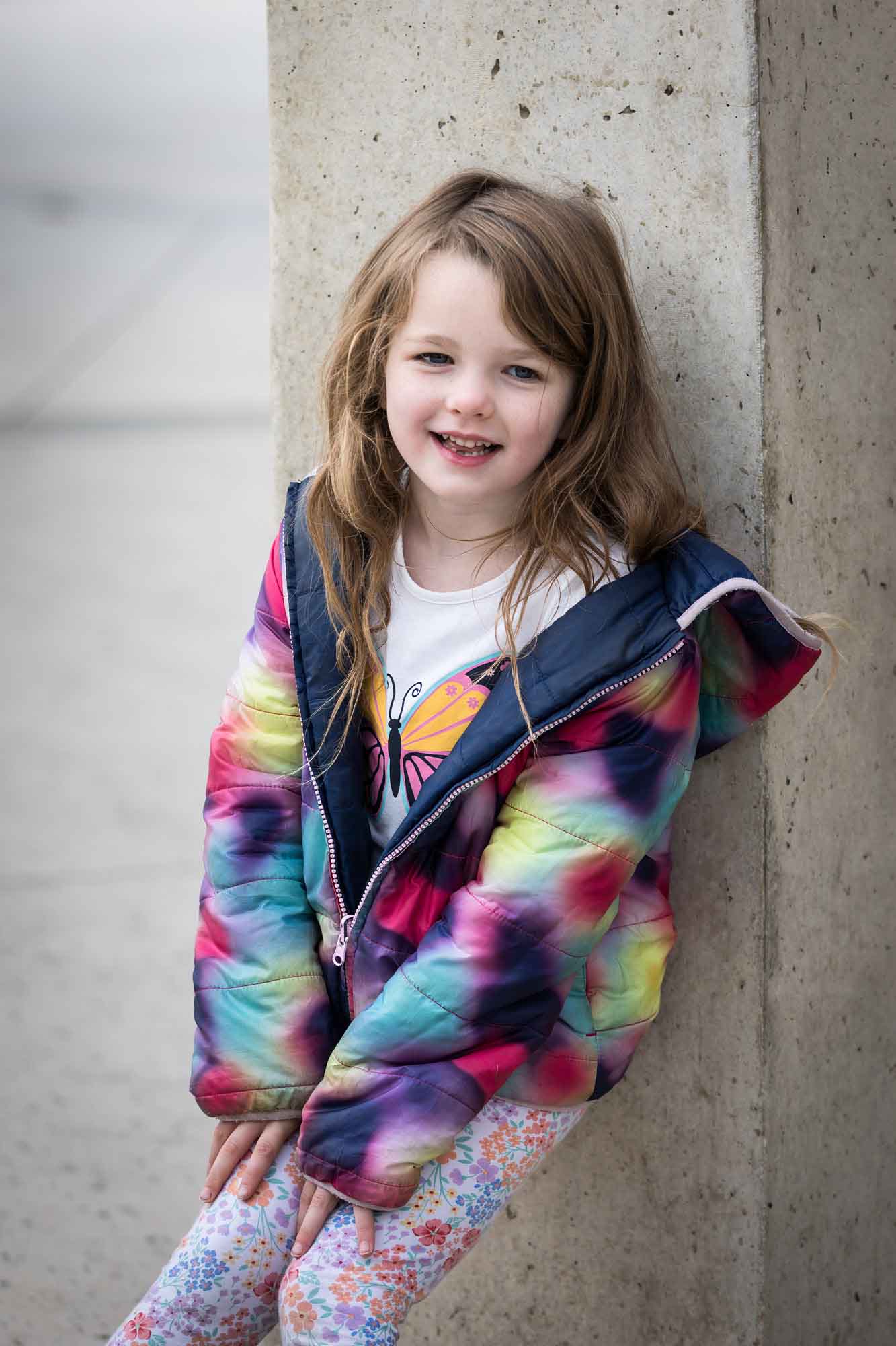 Little girl wearing multicolored sweater during a Confluence Park family portrait session