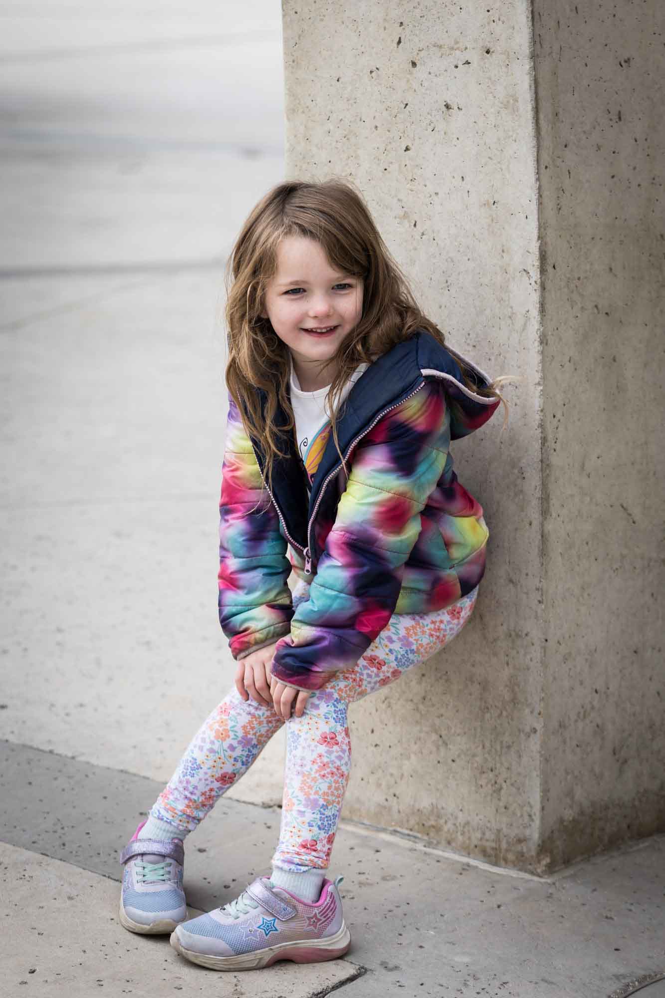 Little girl wearing multicolored sweater during a Confluence Park family portrait session