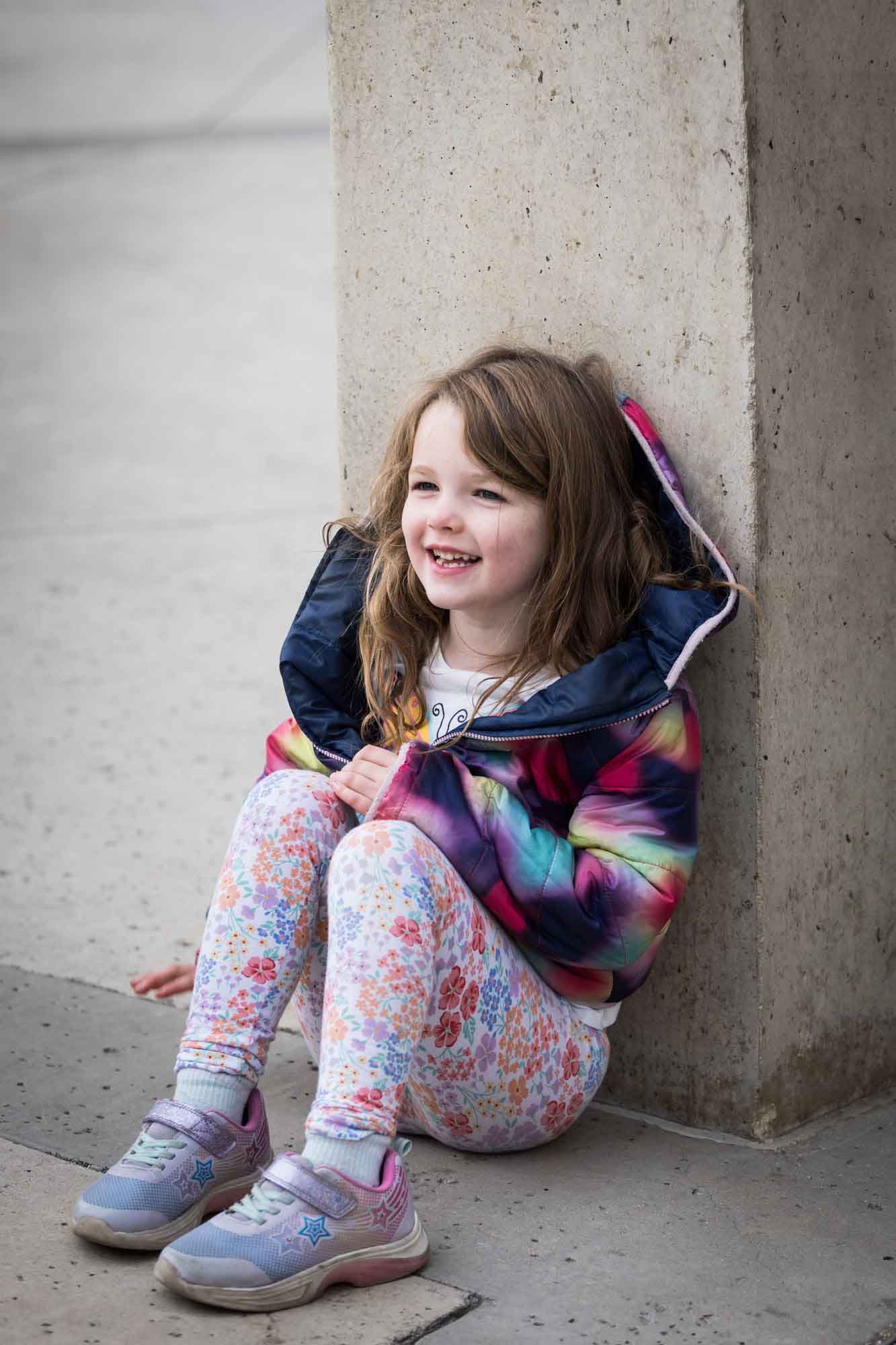 Little girl wearing multicolored sweater during a Confluence Park family portrait session