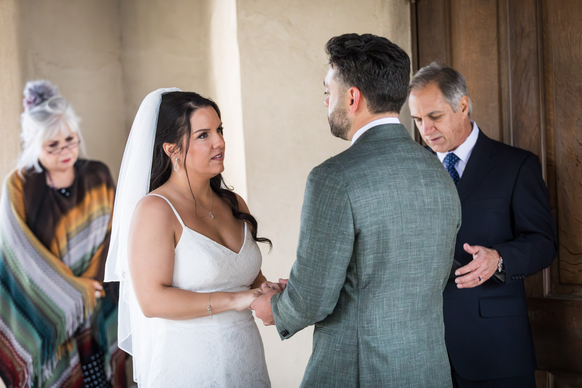 Bride and groom saying vows during ceremony at a Chapel Dulcinea wedding