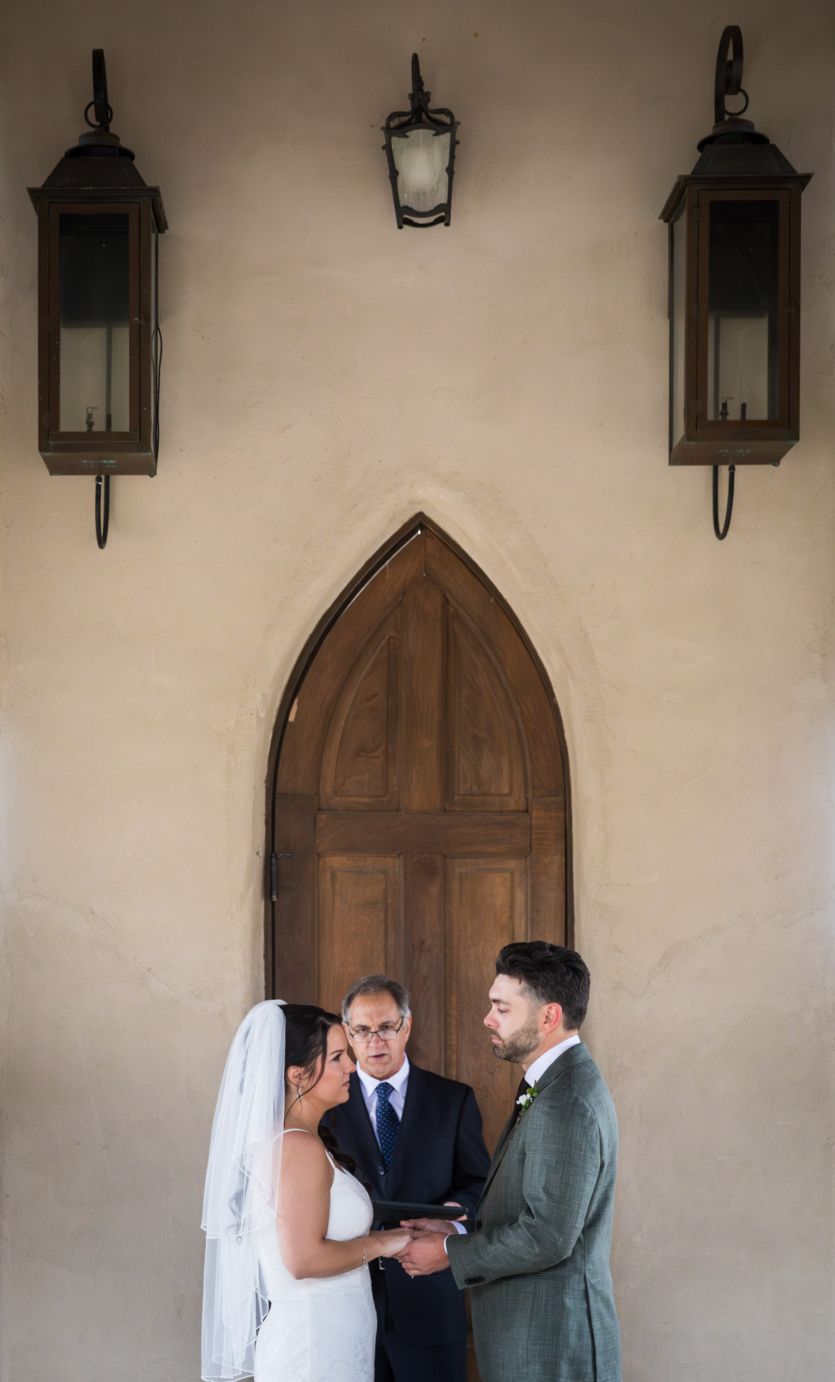 Bride and groom saying vows during ceremony at a Chapel Dulcinea wedding