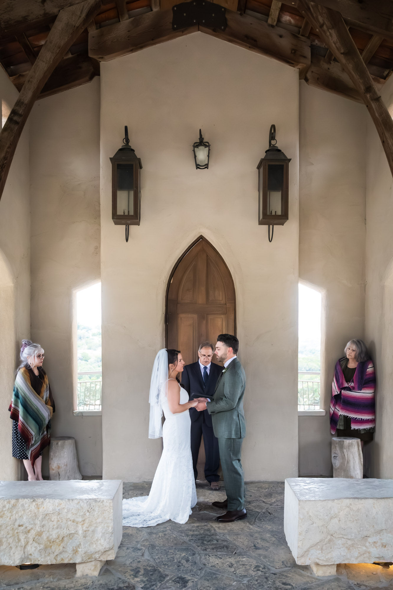 Bride and groom saying vows during ceremony at a Chapel Dulcinea wedding