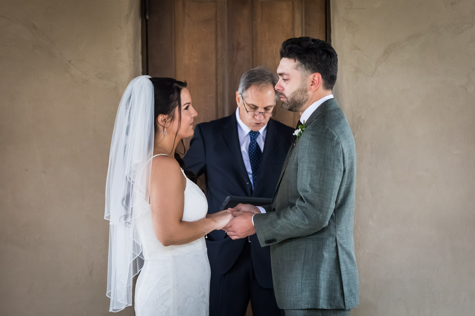 Bride and groom saying vows during ceremony at a Chapel Dulcinea wedding