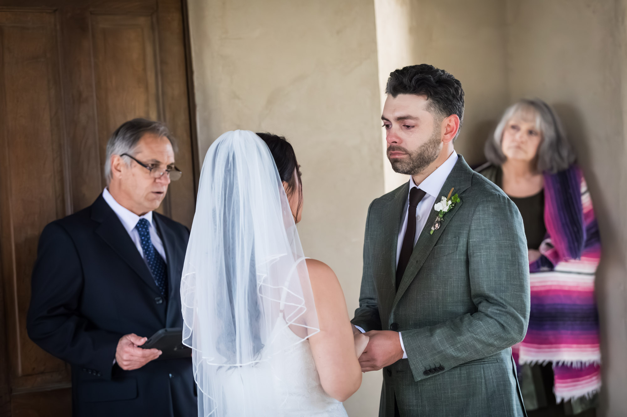 Bride and groom saying vows during ceremony at a Chapel Dulcinea wedding