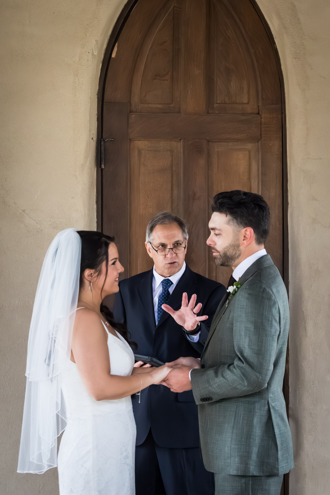Bride and groom saying vows during ceremony at a Chapel Dulcinea wedding