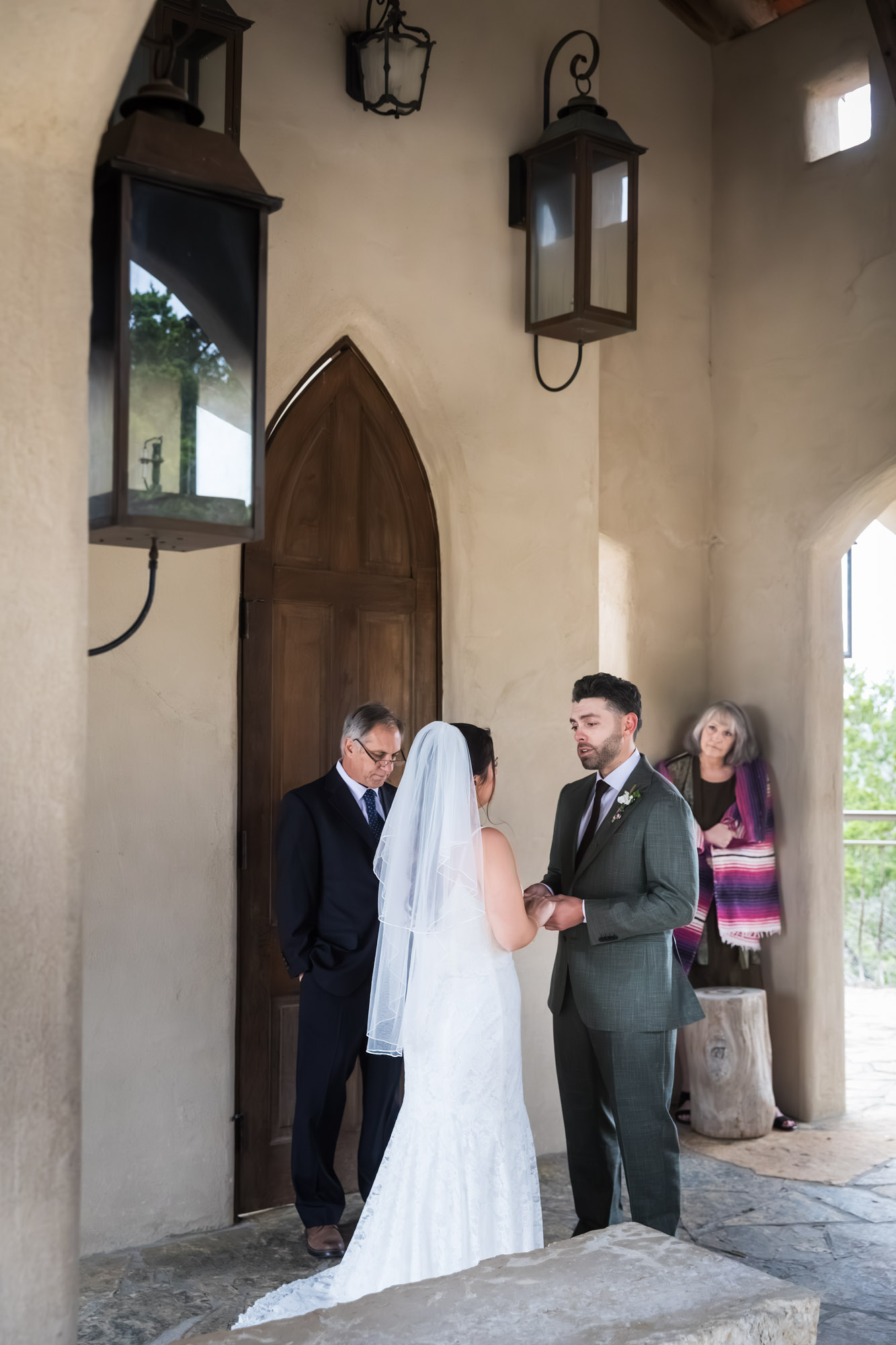 Bride and groom saying vows during ceremony at a Chapel Dulcinea wedding