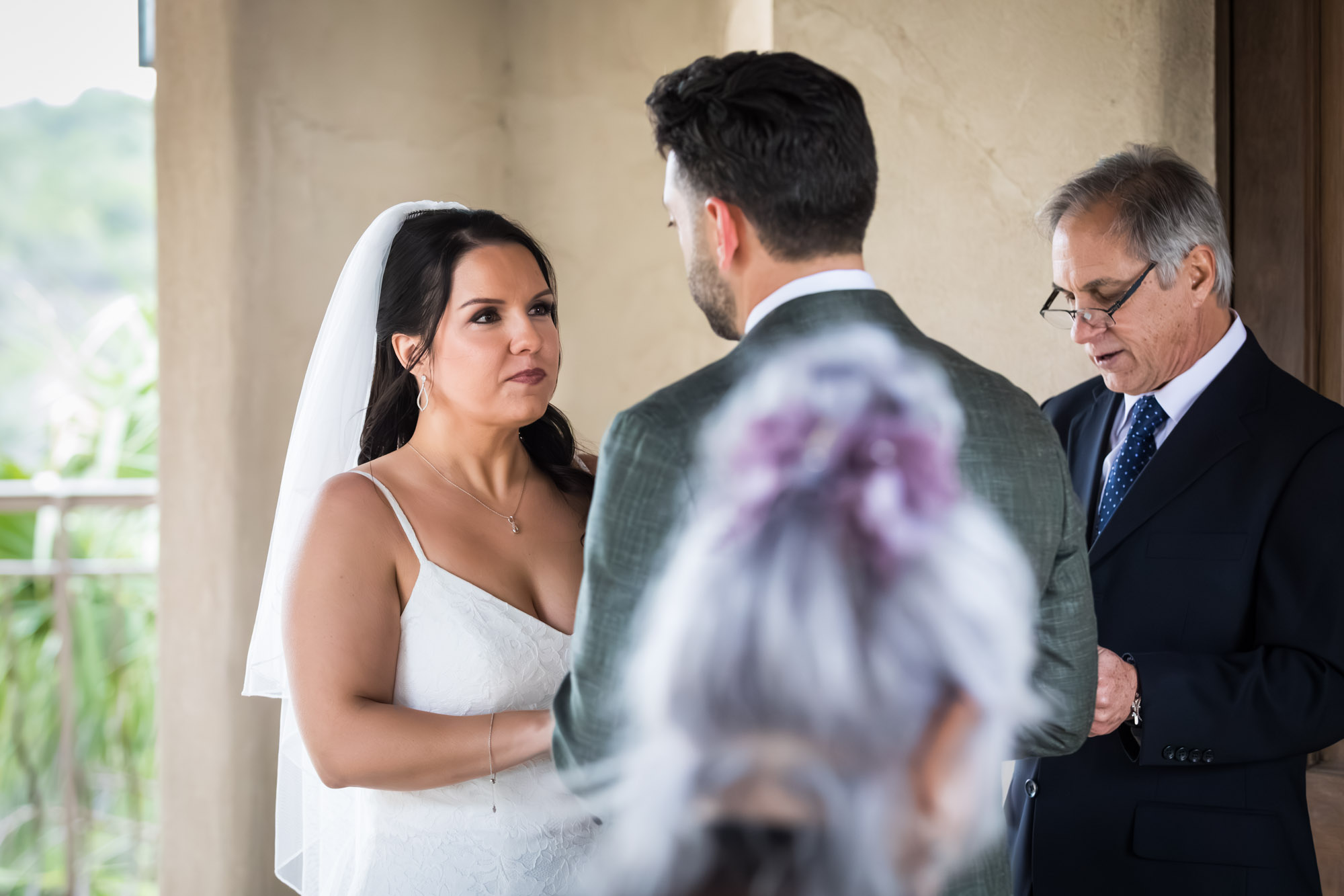 Bride and groom saying vows during ceremony at a Chapel Dulcinea wedding