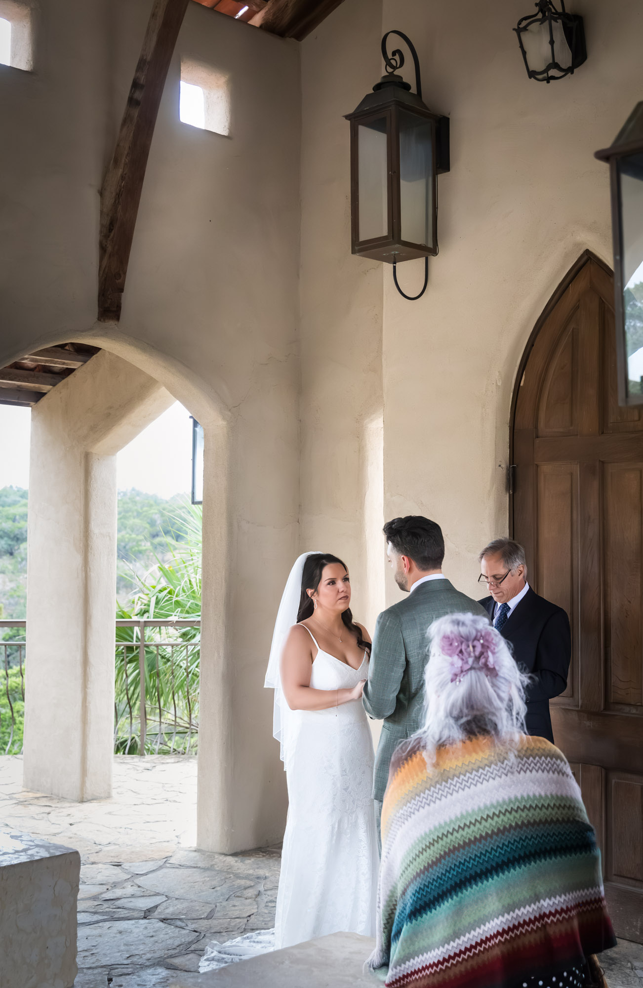 Bride and groom saying vows during ceremony at a Chapel Dulcinea wedding