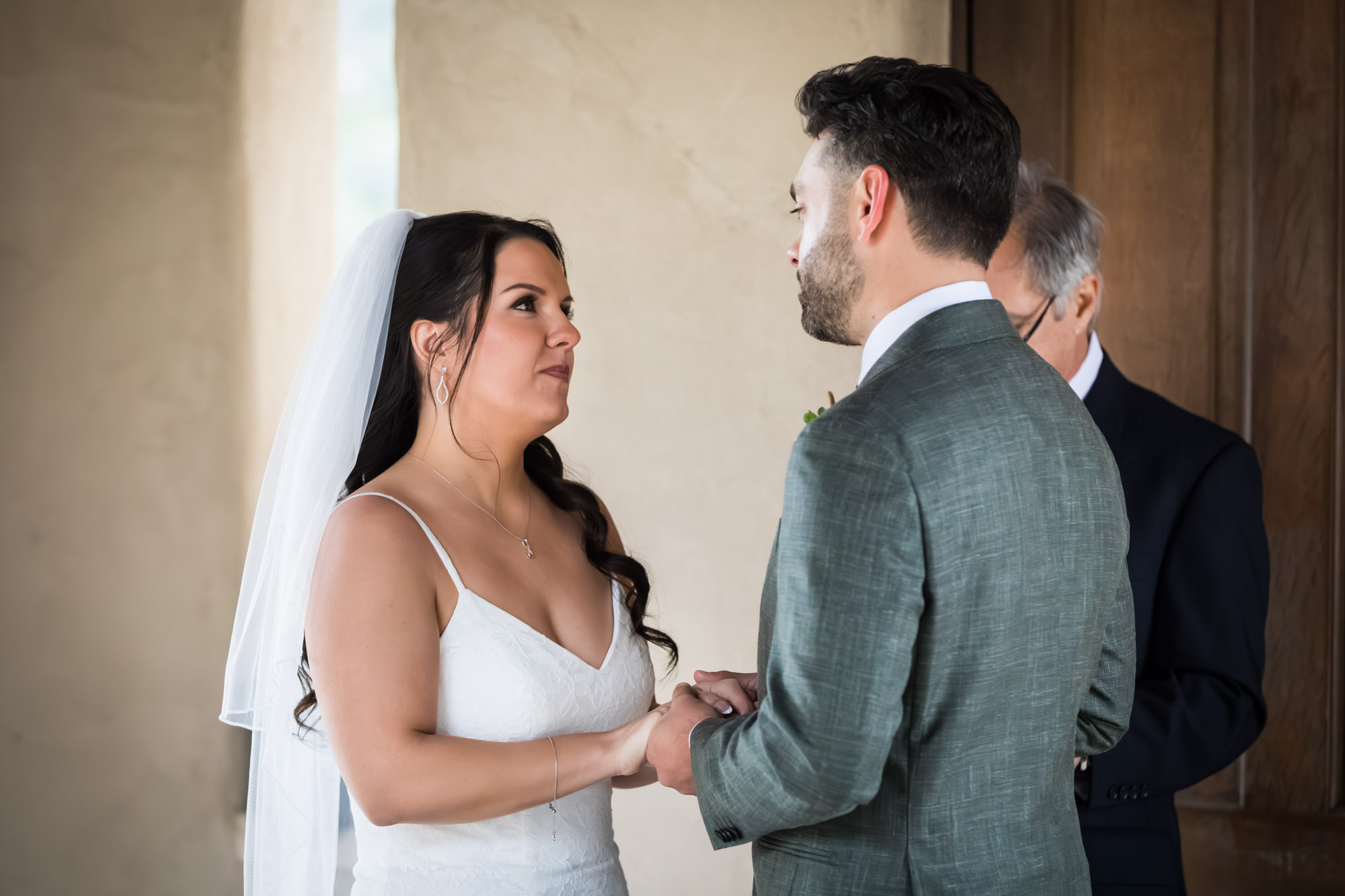 Bride saying vows to groom during ceremony at a Chapel Dulcinea wedding