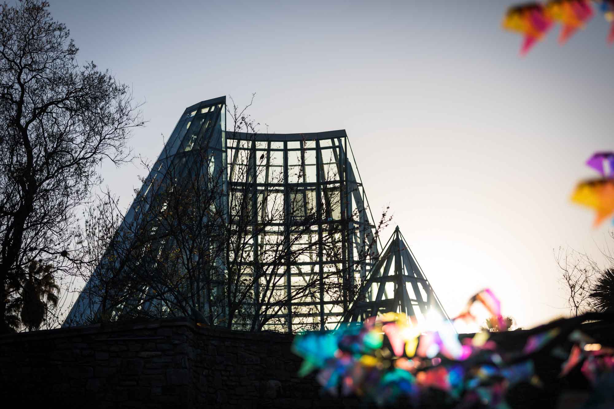 Sun rising over the Lucile Halsell Conservatory before a San Antonio Botanical Garden wedding ceremony