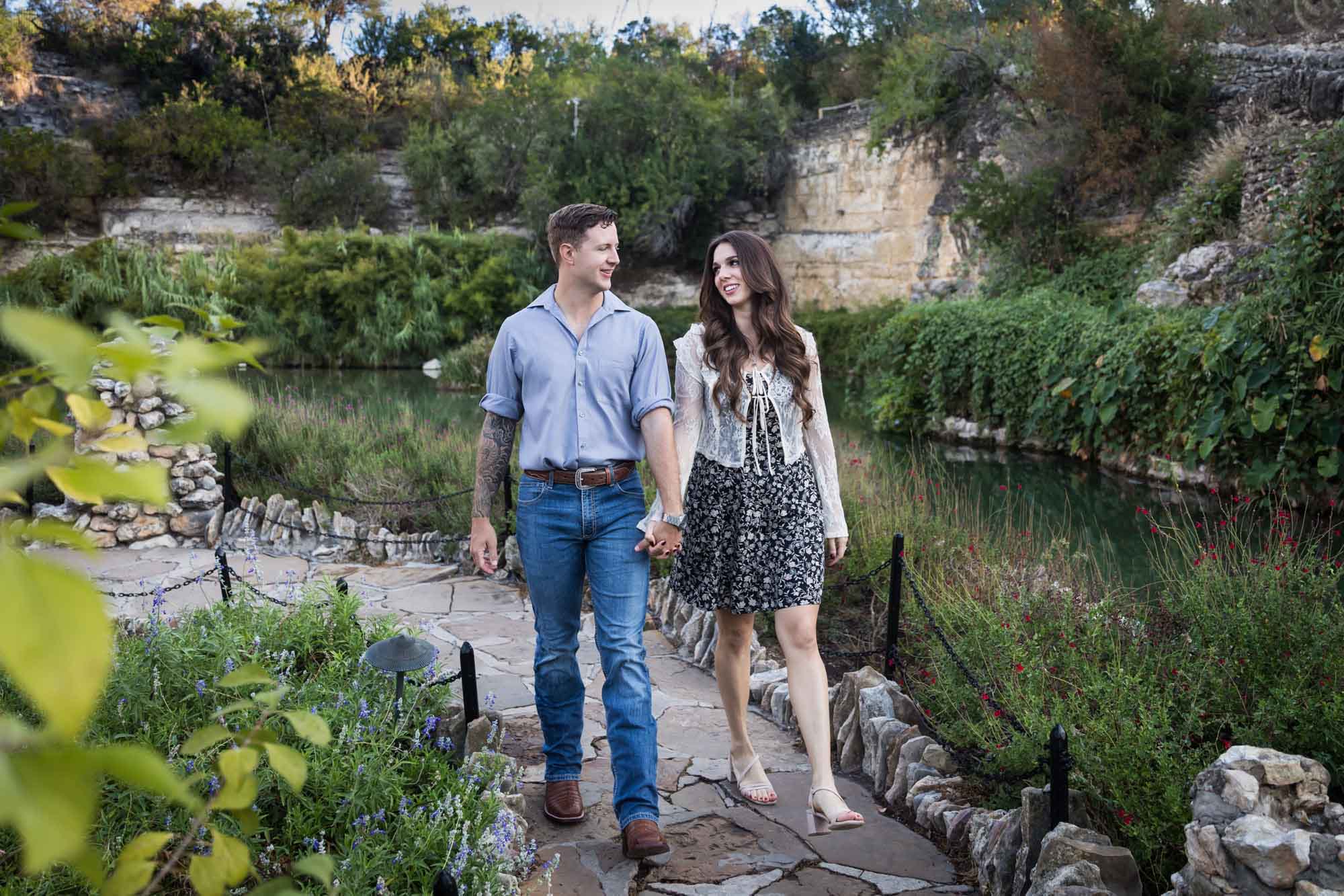 Couple holding hands and walking in the Japanese Tea Garden during an engagement shoot for an article on ‘Where do I Start with Wedding Planning?’