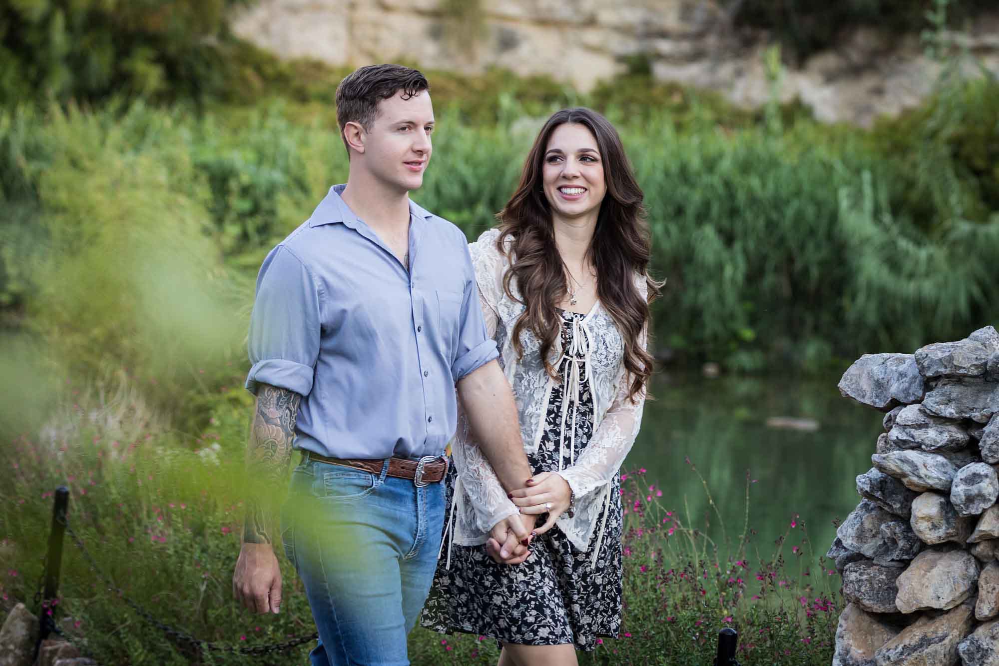 Couple holding hands and walking in the Japanese Tea Garden during an engagement shoot for an article on ‘Where do I Start with Wedding Planning?’