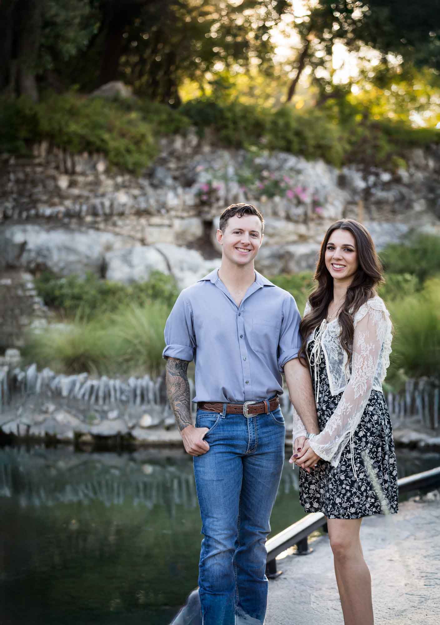 Couple holding hands and walking in the Japanese Tea Garden during an engagement shoot for an article on ‘Where do I Start with Wedding Planning?’