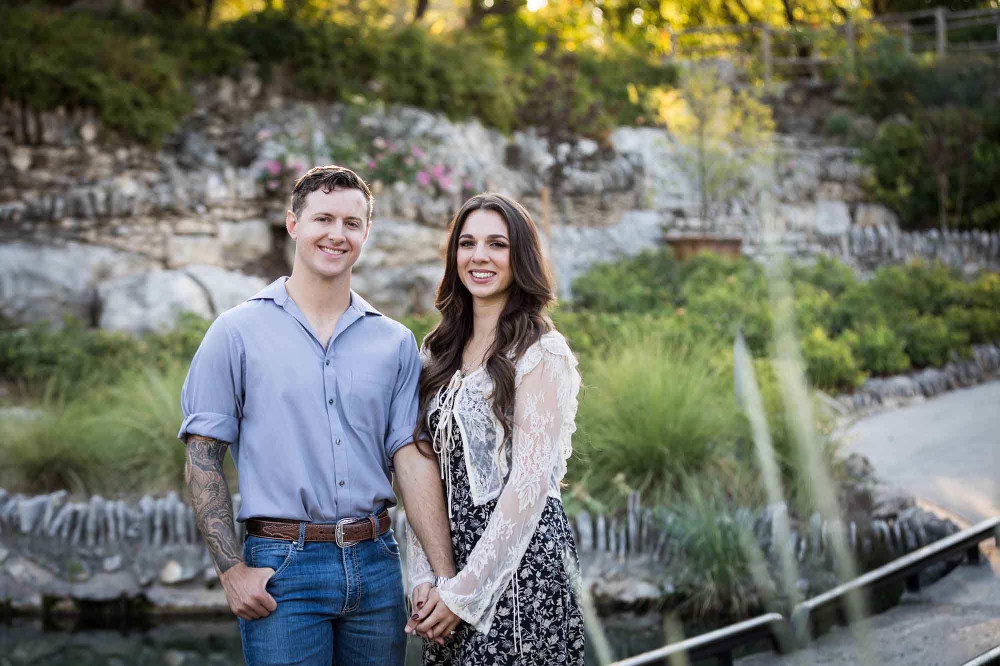 Couple holding hands and walking in the Japanese Tea Garden during an engagement shoot for an article on ‘Where do I Start with Wedding Planning?’