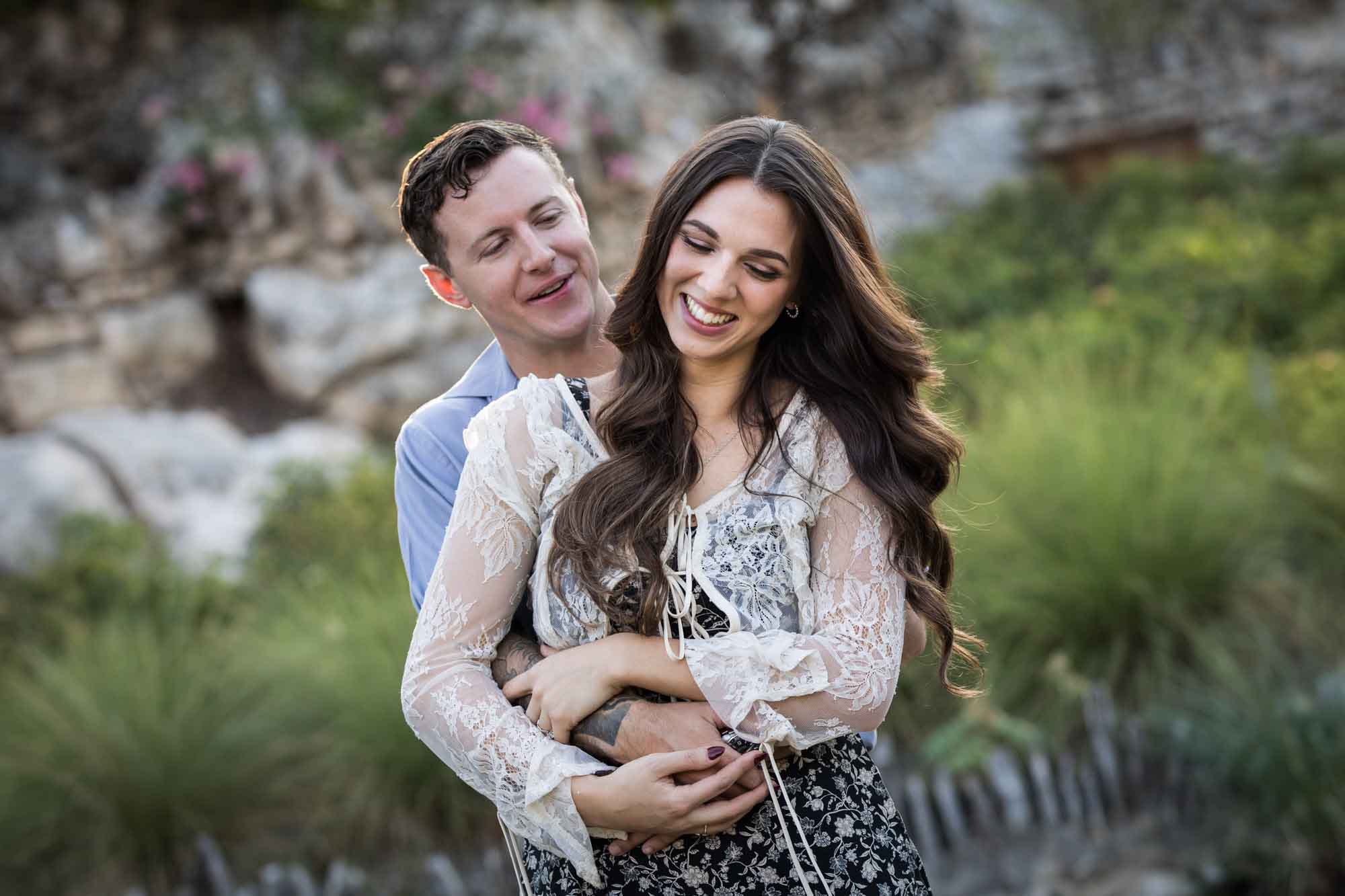 Couple hugging in the Japanese Tea Garden during an engagement shoot for an article on ‘Where do I Start with Wedding Planning?’