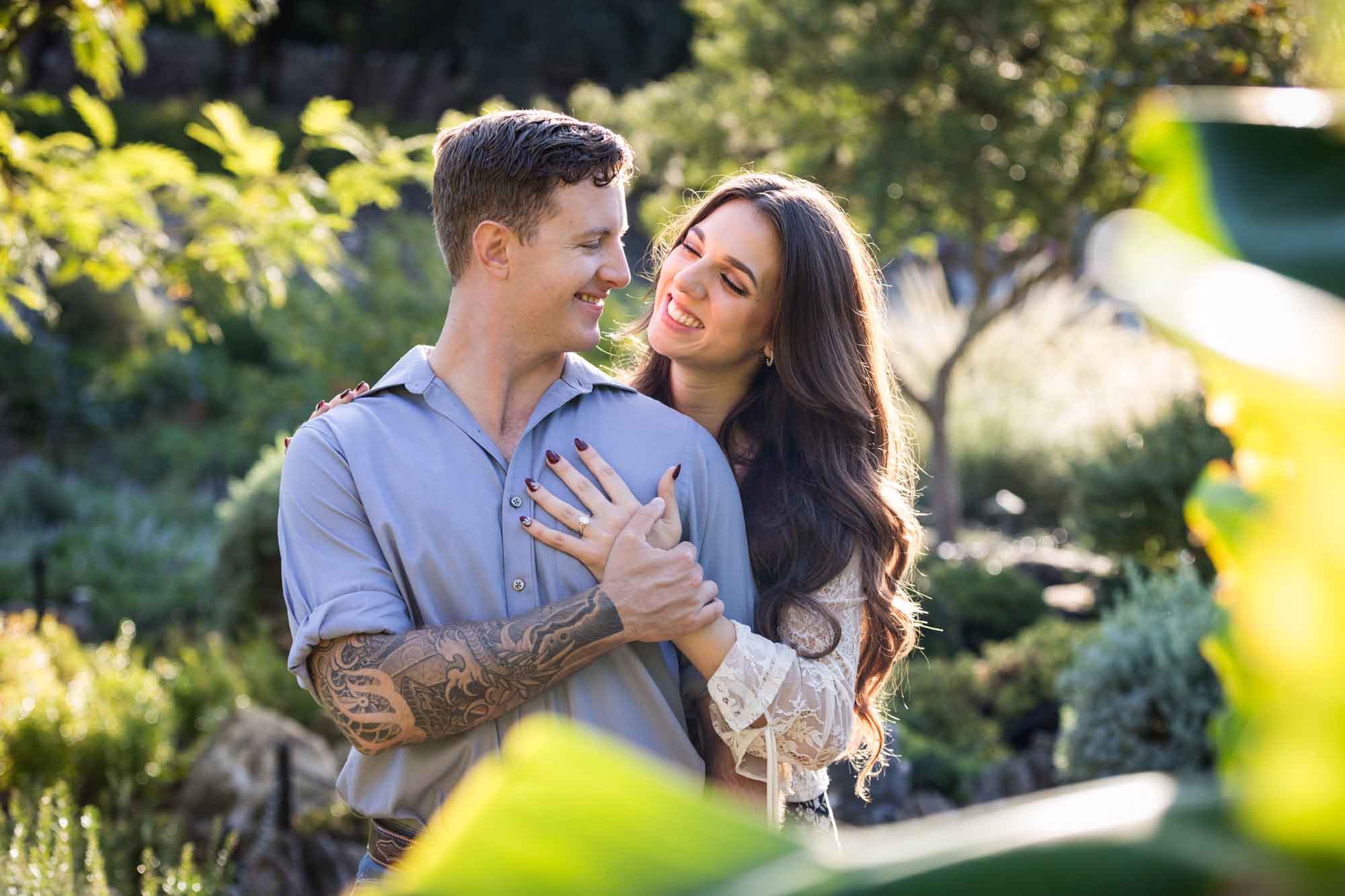 Couple hugging in Japanese Tea Garden for an article on ‘Where do I Start with Wedding Planning?’