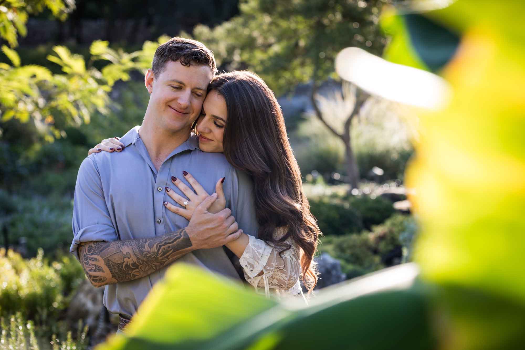 Couple hugging in Japanese Tea Garden for an article on ‘Where do I Start with Wedding Planning?’