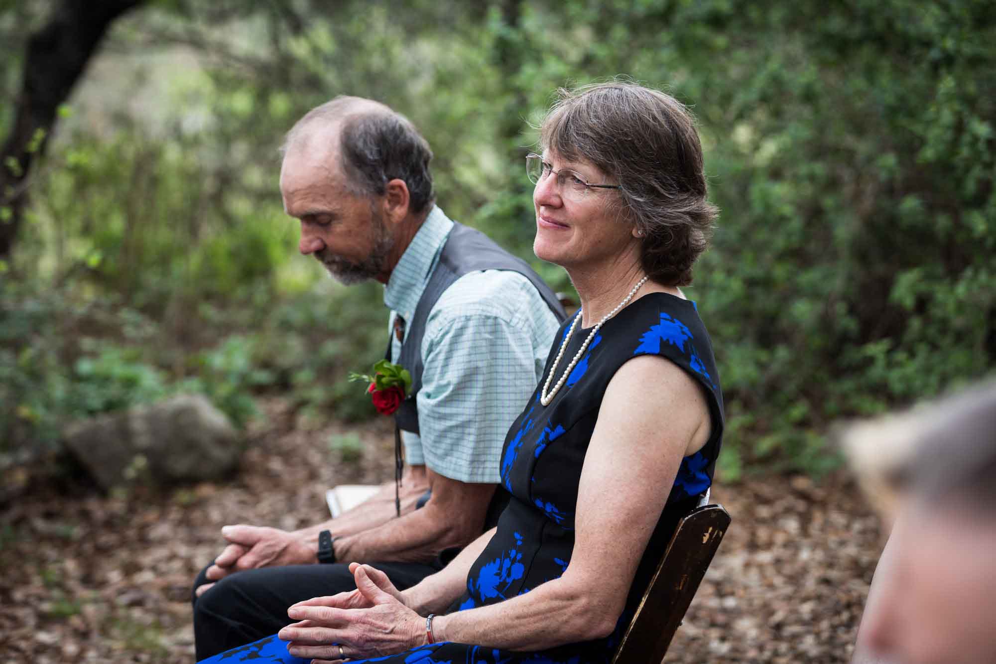 Mother and father of groom seated during a Lady Bird Johnson Wildflower Center wedding