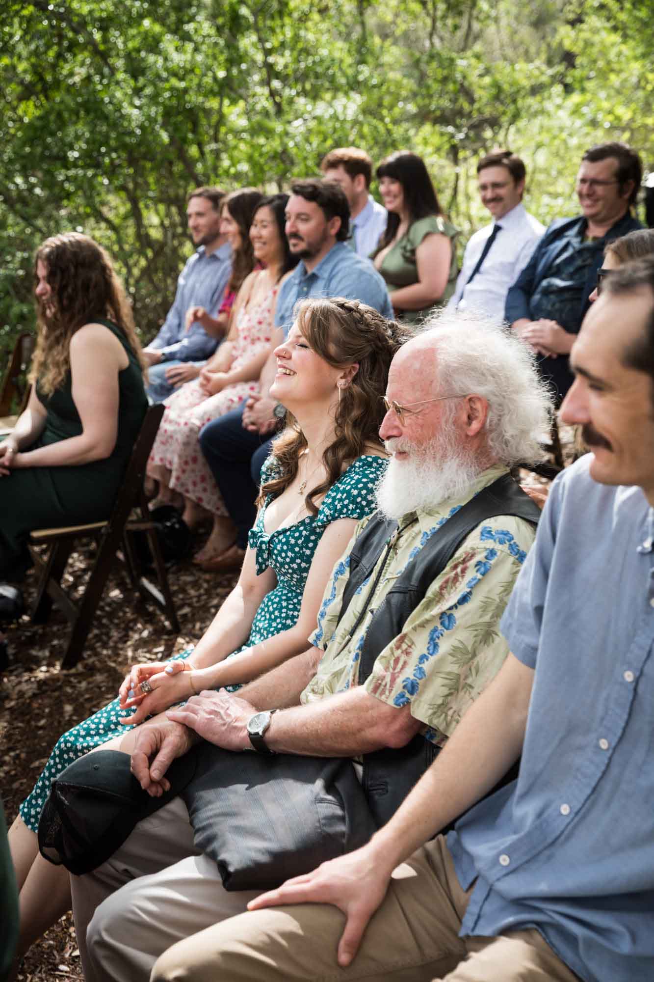 Seated guests at Cecille's Arch during a Lady Bird Johnson Wildflower Center wedding