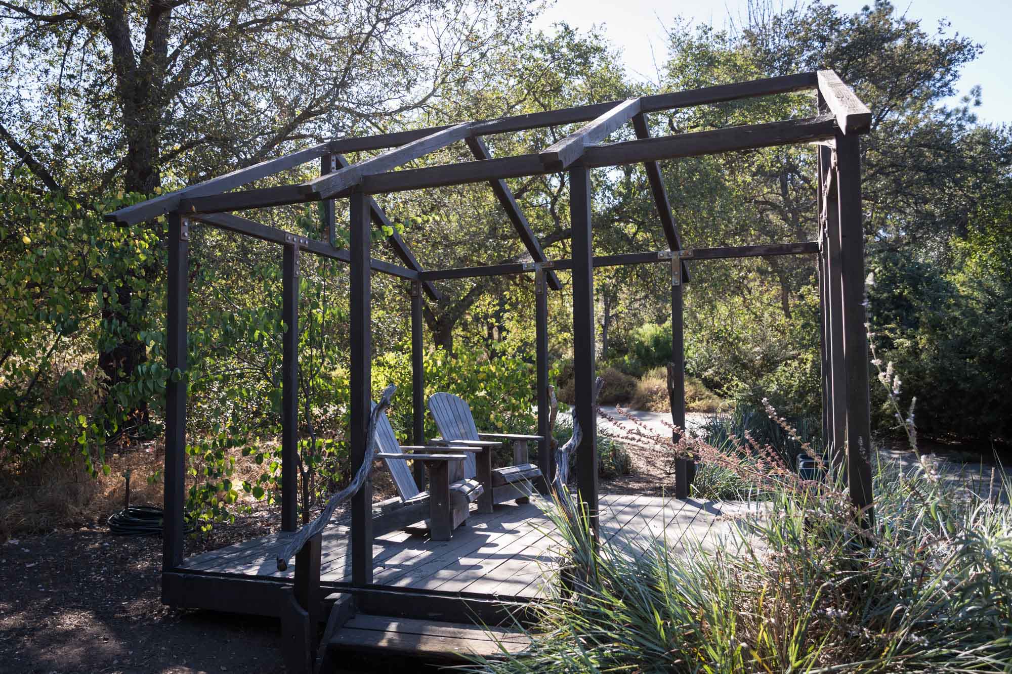 Mountain view wooden gazebo with two adirondack chairs for an article on the best photo shoot locations in Descanso Gardens