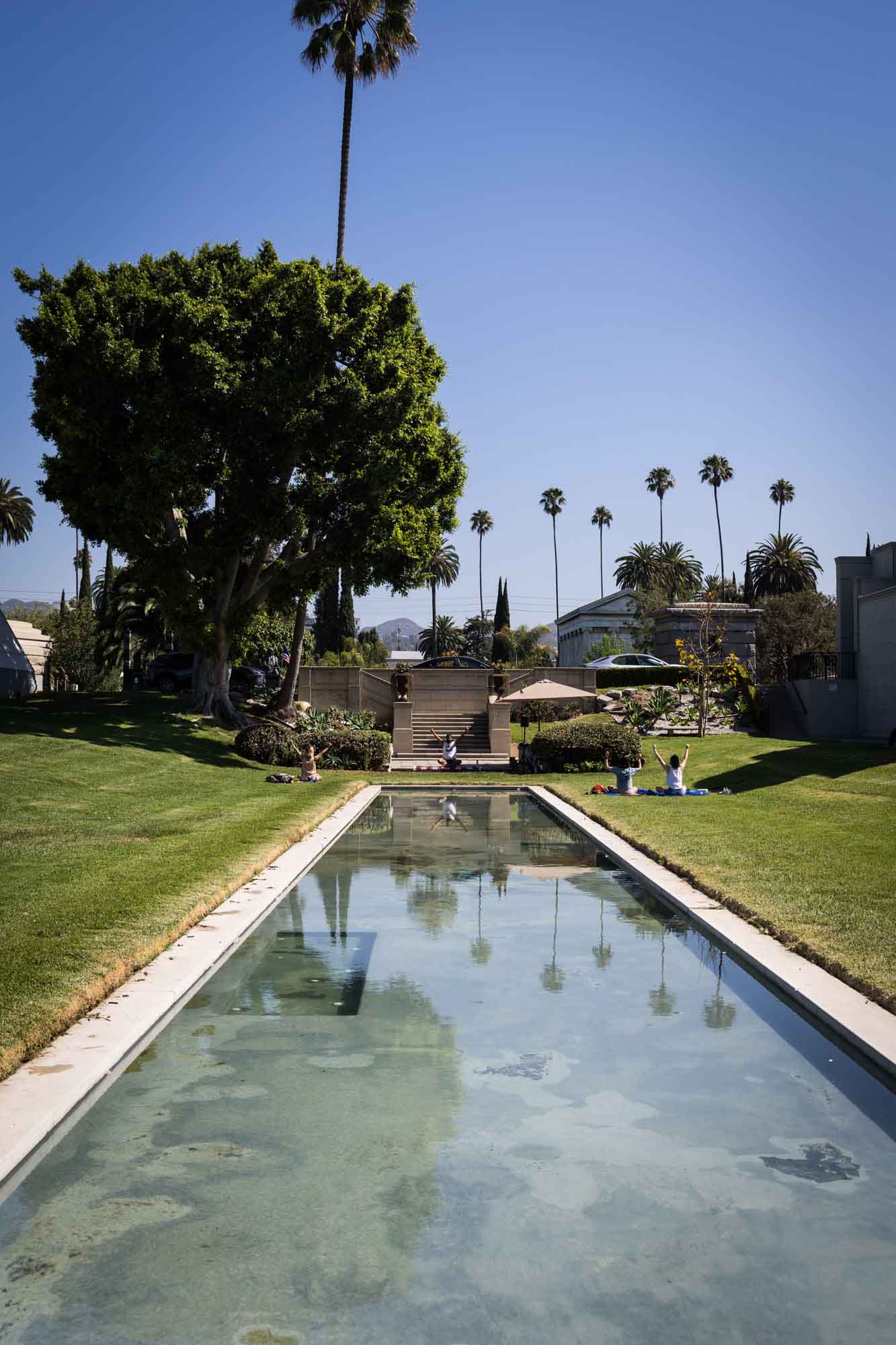 Yoga class taking place in Fairbanks Garden at the Hollywood Forever Cemetery