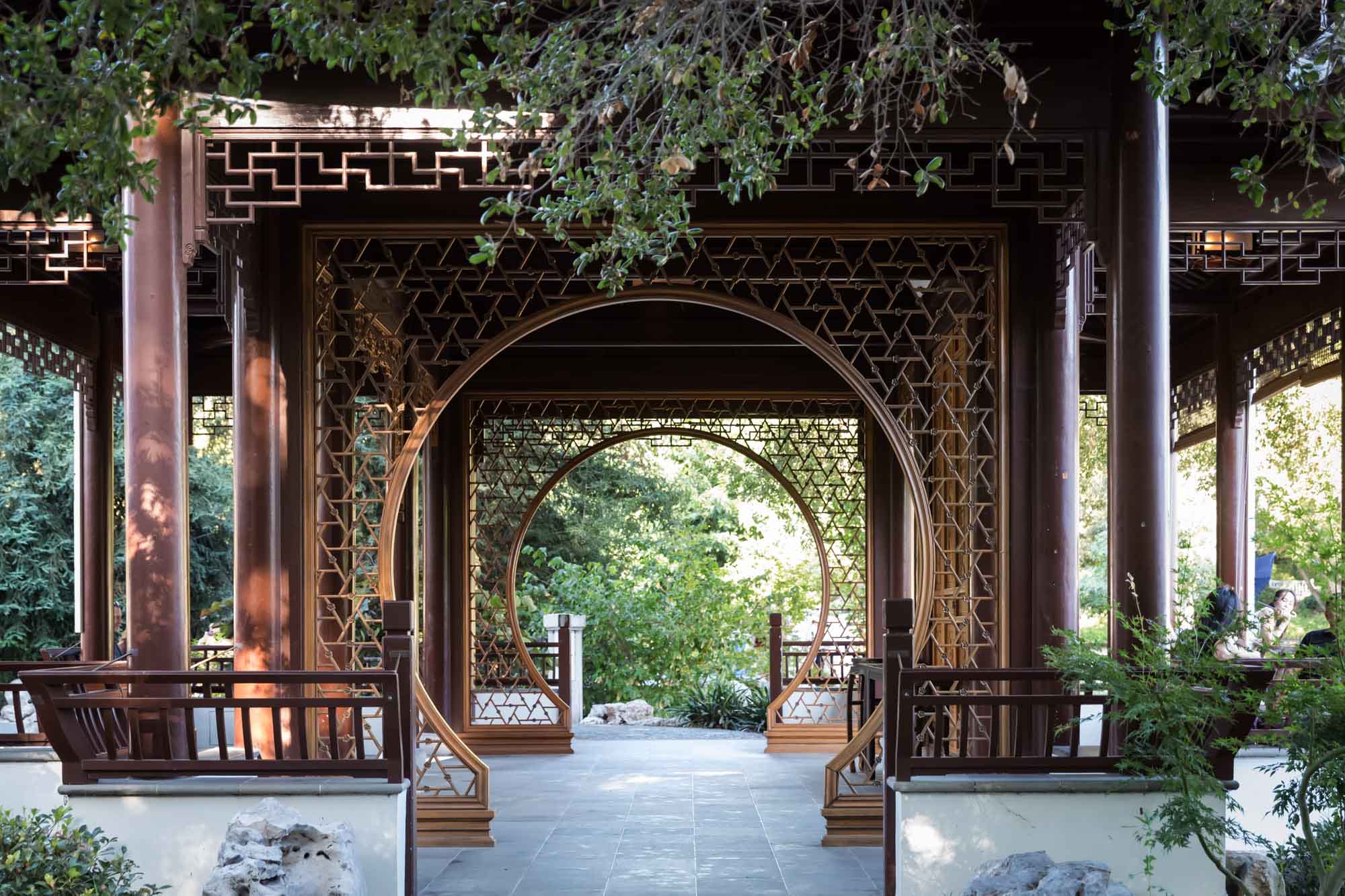 View through wooden scaffolding of ornate building in Chinese Garden for a Huntington Gardens photo shoot guide article