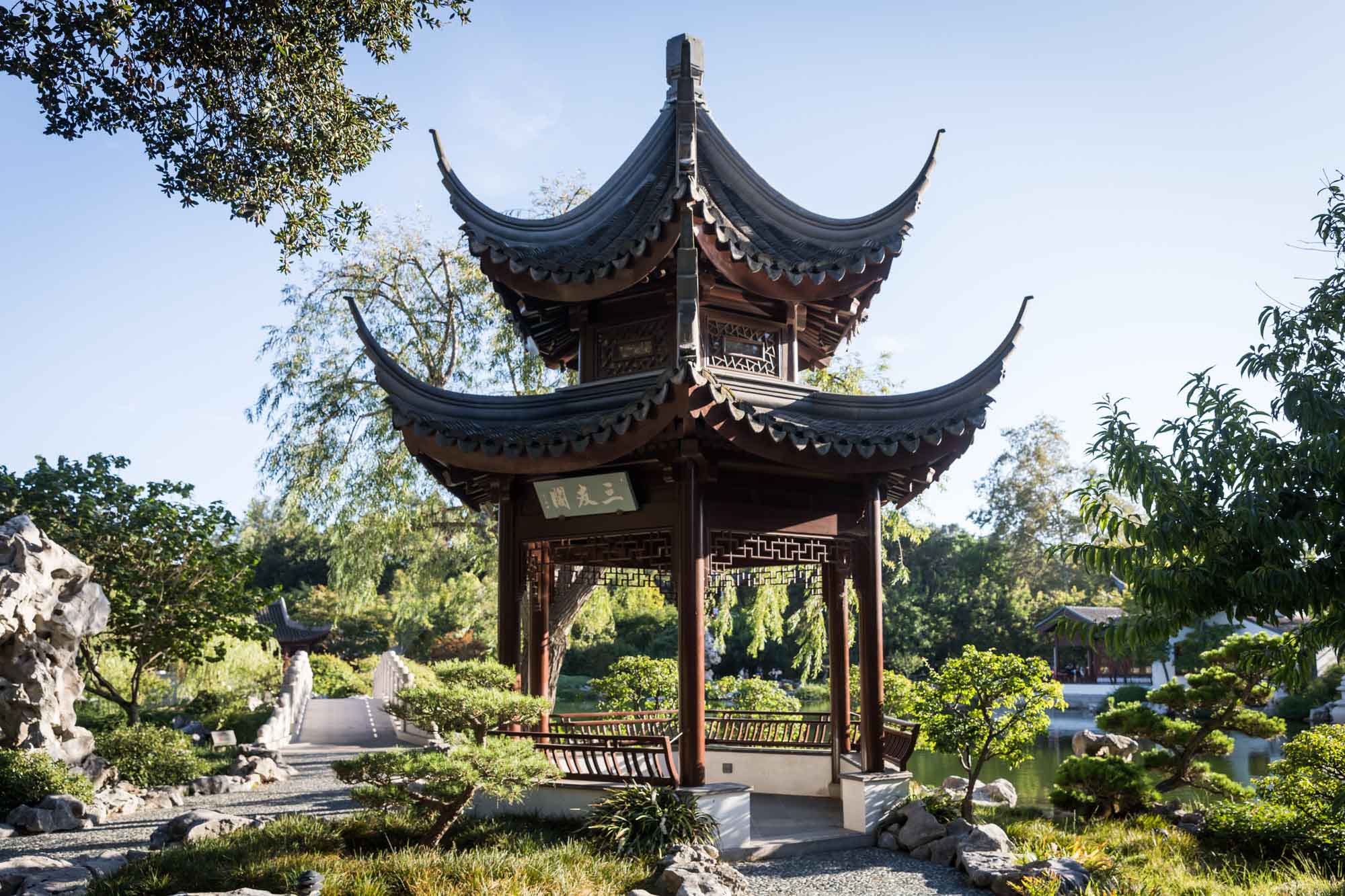 Asian-style building with pitched roof in Chinese Garden for a Huntington Gardens photo shoot guide article