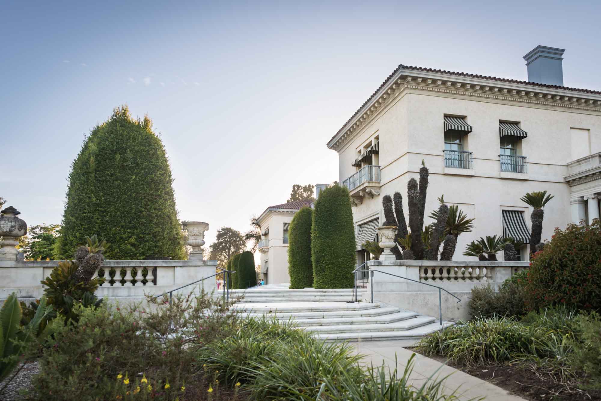 Stairs and entrance to the Huntington Art Gallery building at sunset for a Huntington Gardens photo shoot guide article