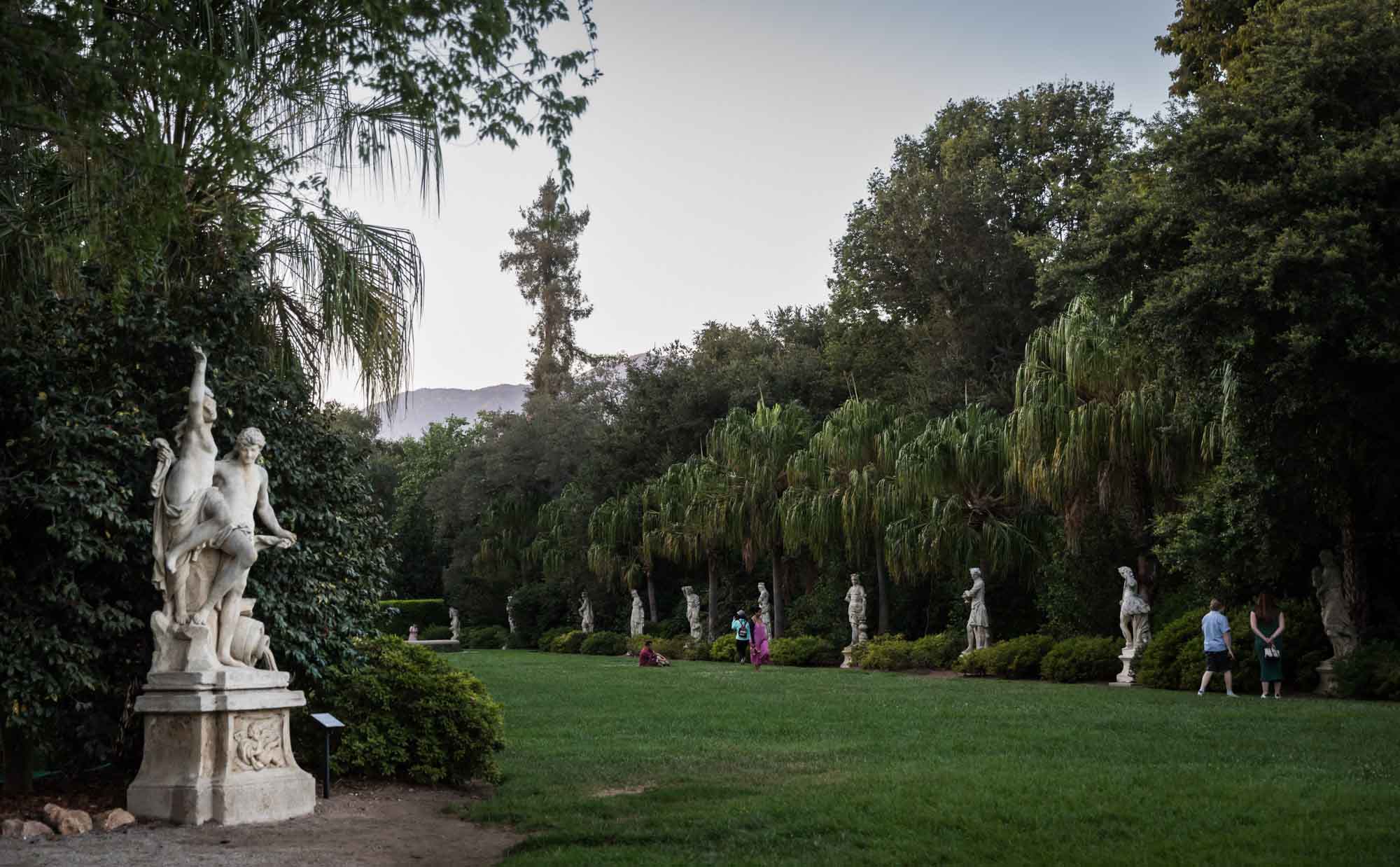 North Vista sculpture garden with visitors looking at stone sculptures for a Huntington Gardens photo shoot guide article