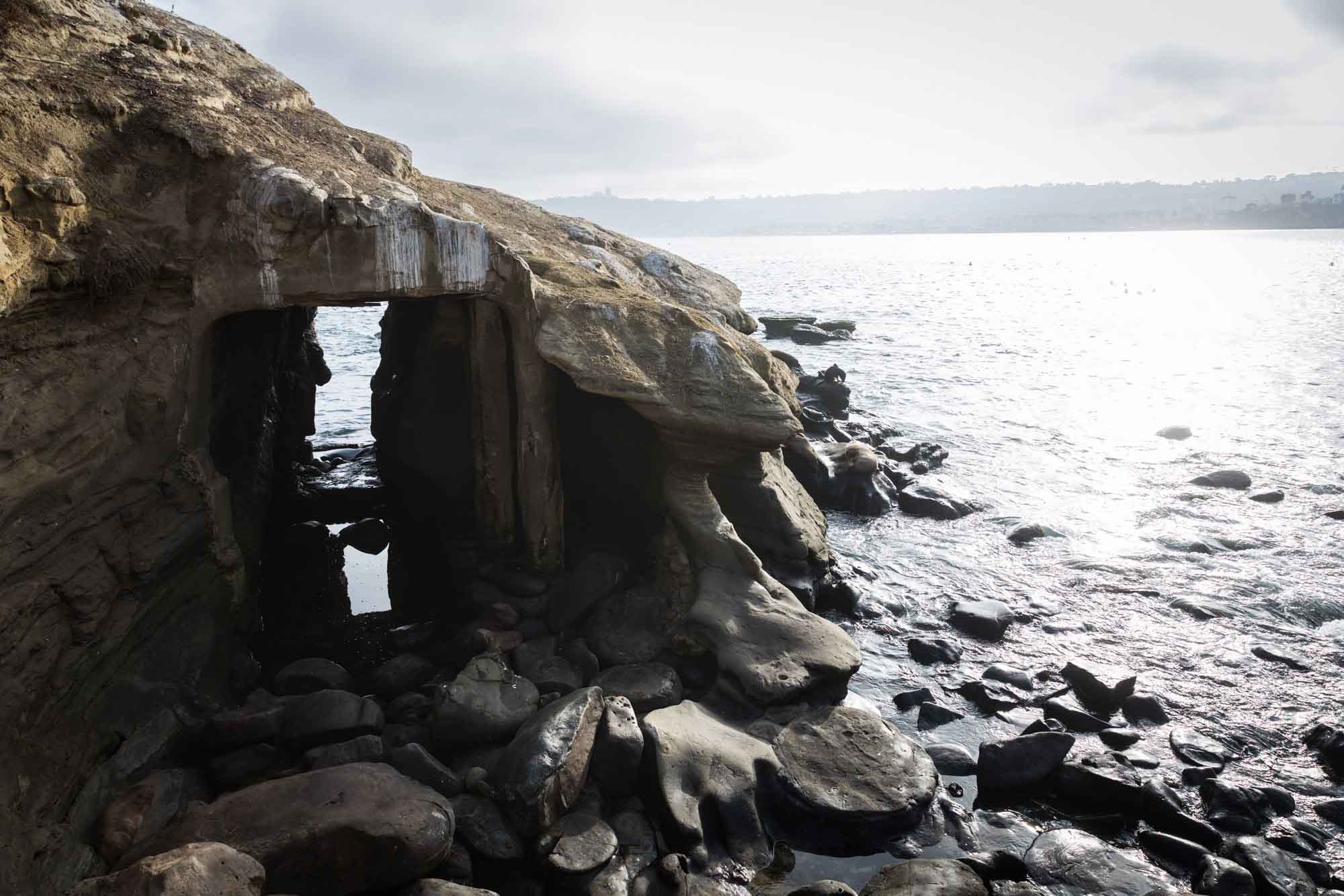Sea cave and rocks at La Jolla Cove for an article on La Jolla Cove family photos
