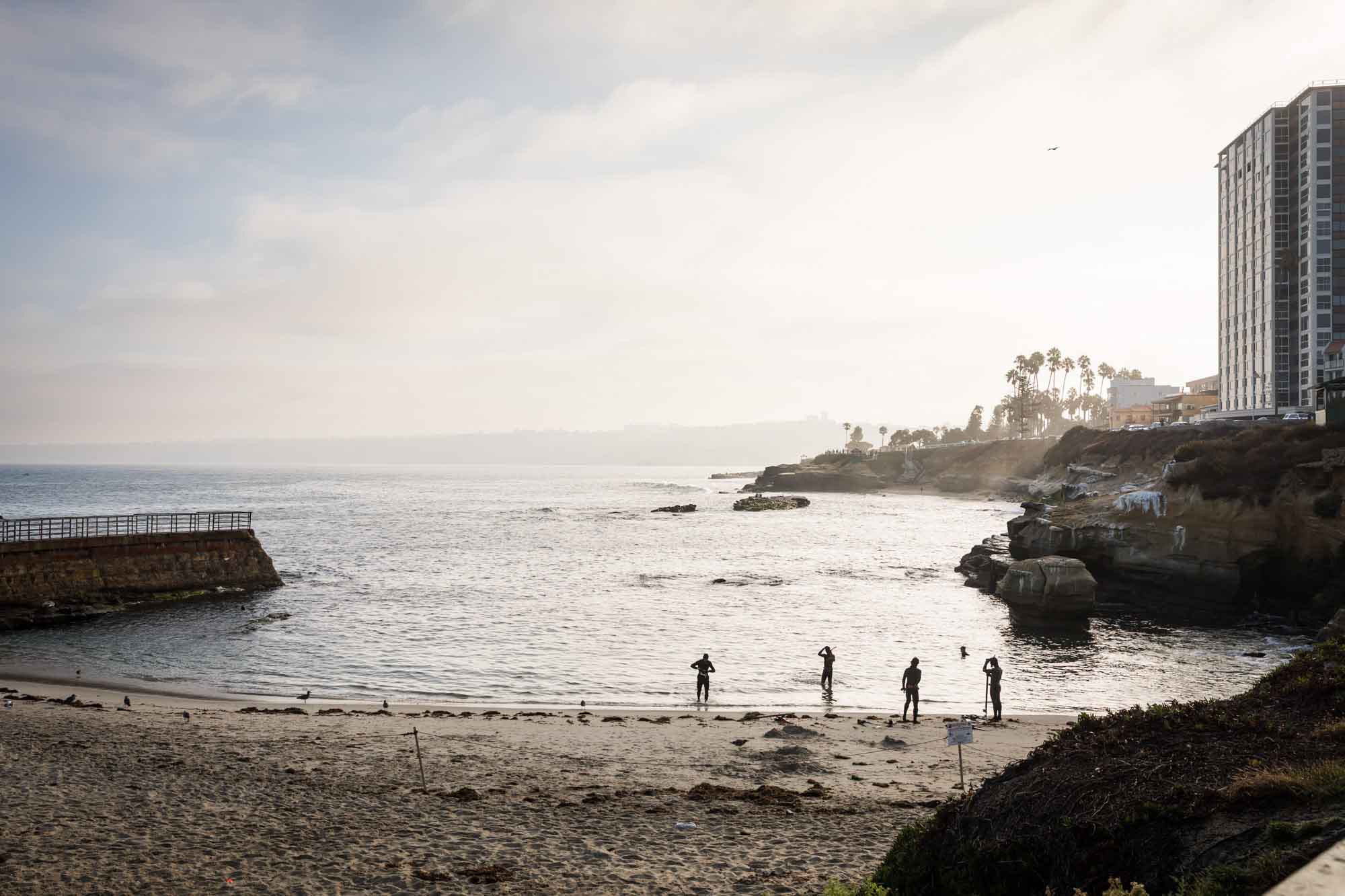 Divers getting ready to enter the water a La Jolla Cove for an article on La Jolla Cove family photos