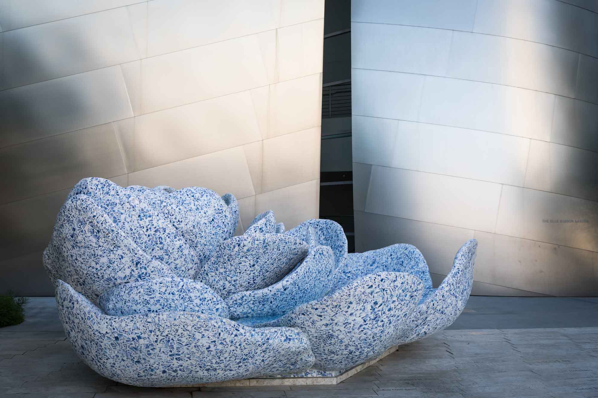 A Rose for Lilly blue mosaic-covered fountain in front of silver covered walls of Walt Disney Concert Hall for an article on Walt Disney Concert Hall photos