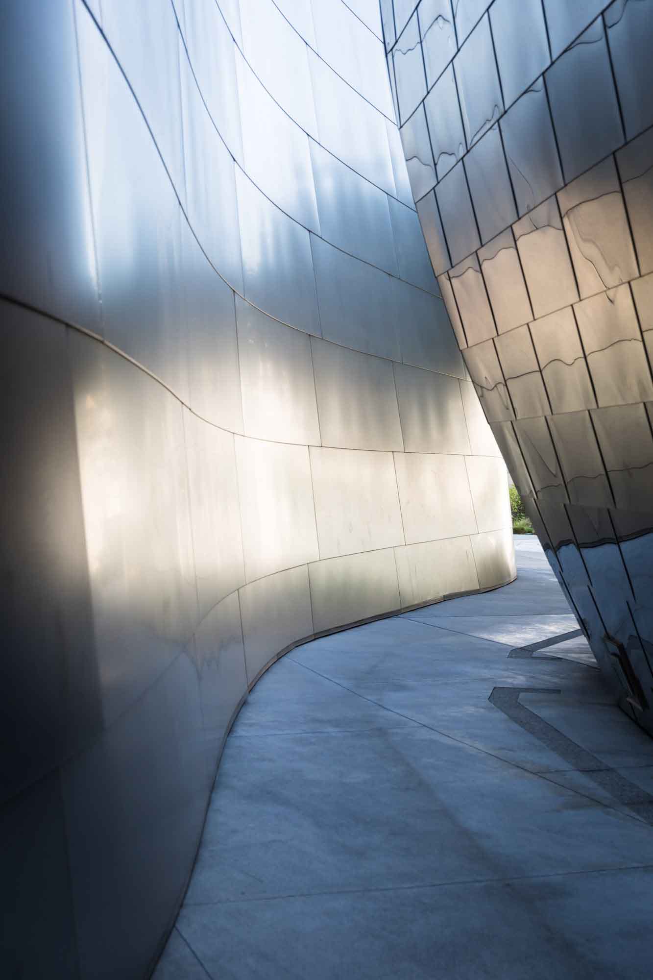Silver-walled passageway with concrete floor in Blue Ribbon Garden for an article on Walt Disney Concert Hall photos