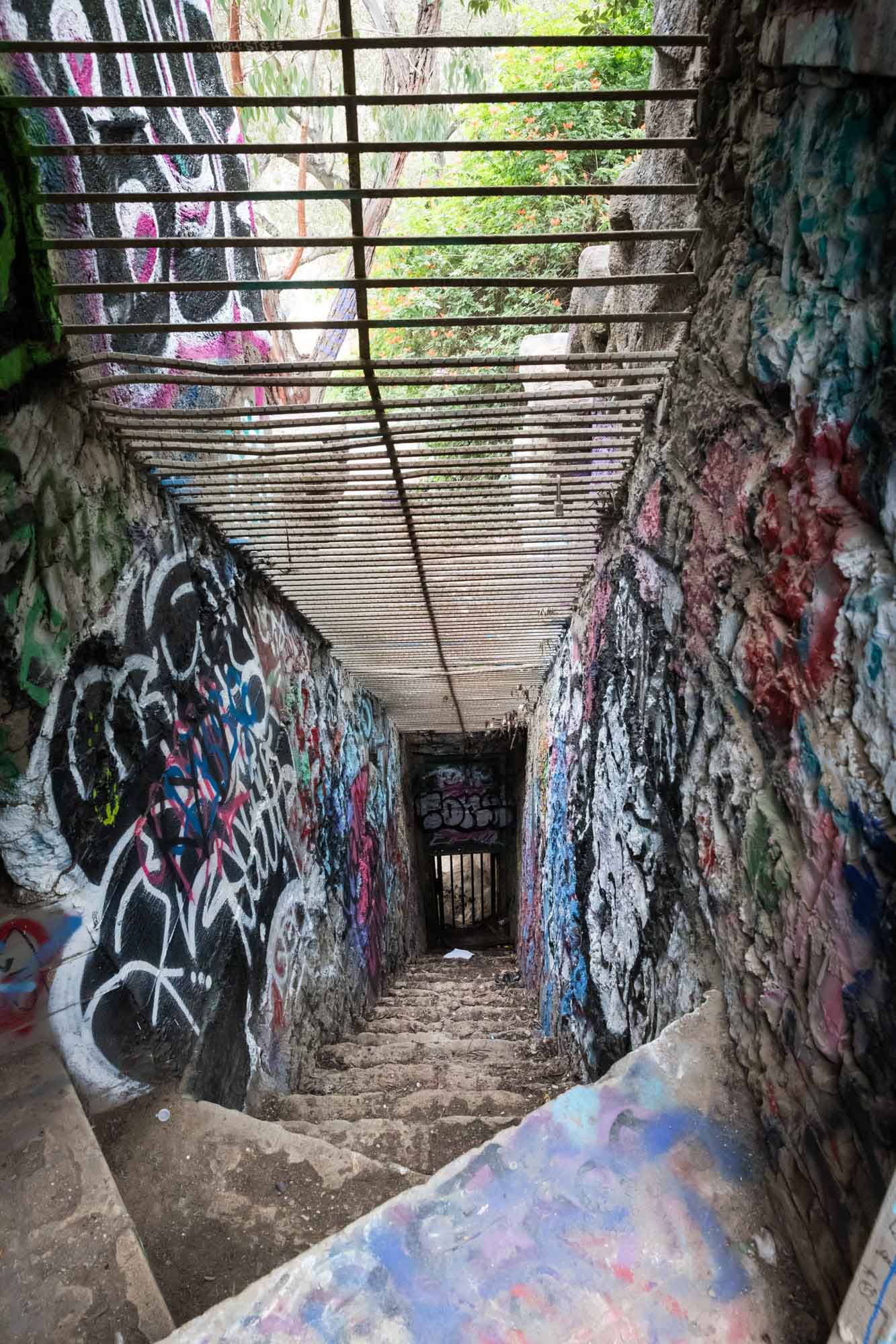 Colorful graffiti walls along stone staircase of animal enclosure in Old Los Angeles Zoo in Griffith Park for an article on where to propose at the Griffith Observatory