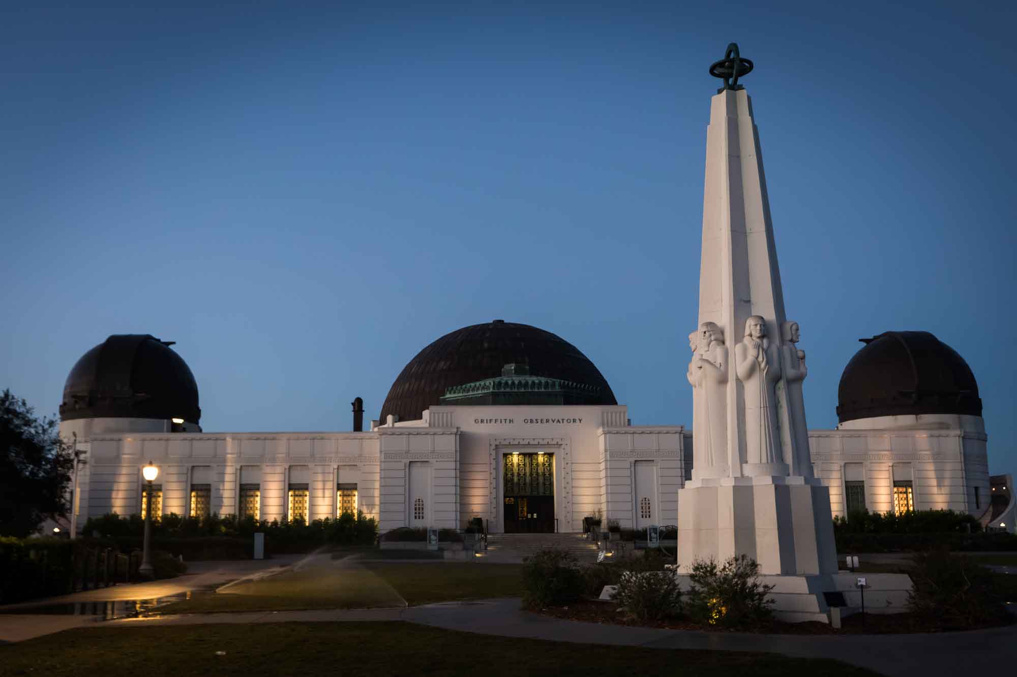 Griffith Observatory entrance and Astronomers Monument sculpture before sunrise for an article on where to propose at the Griffith Observatory