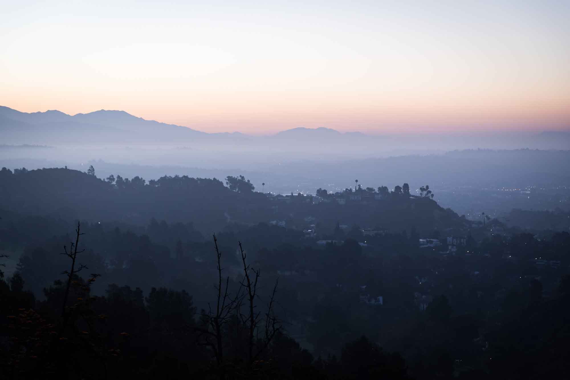 Los Angeles skyline and Griffith Park at sunrise as viewed from the East Terrace for an article on where to propose at the Griffith Observatory