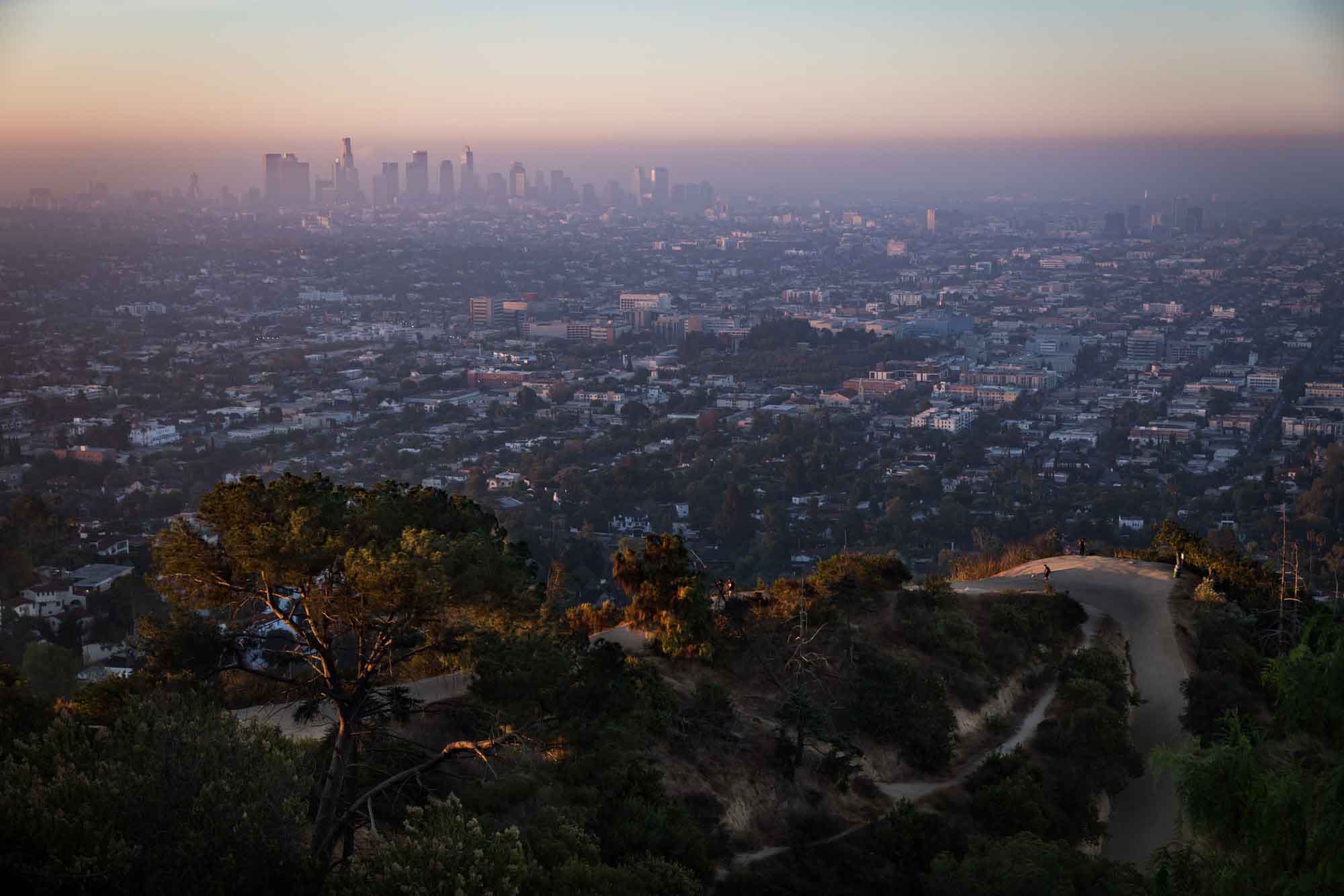 View of Griffith Observatory and Los Angeles skyline at sunset for an article on where to propose at the Griffith Observatory