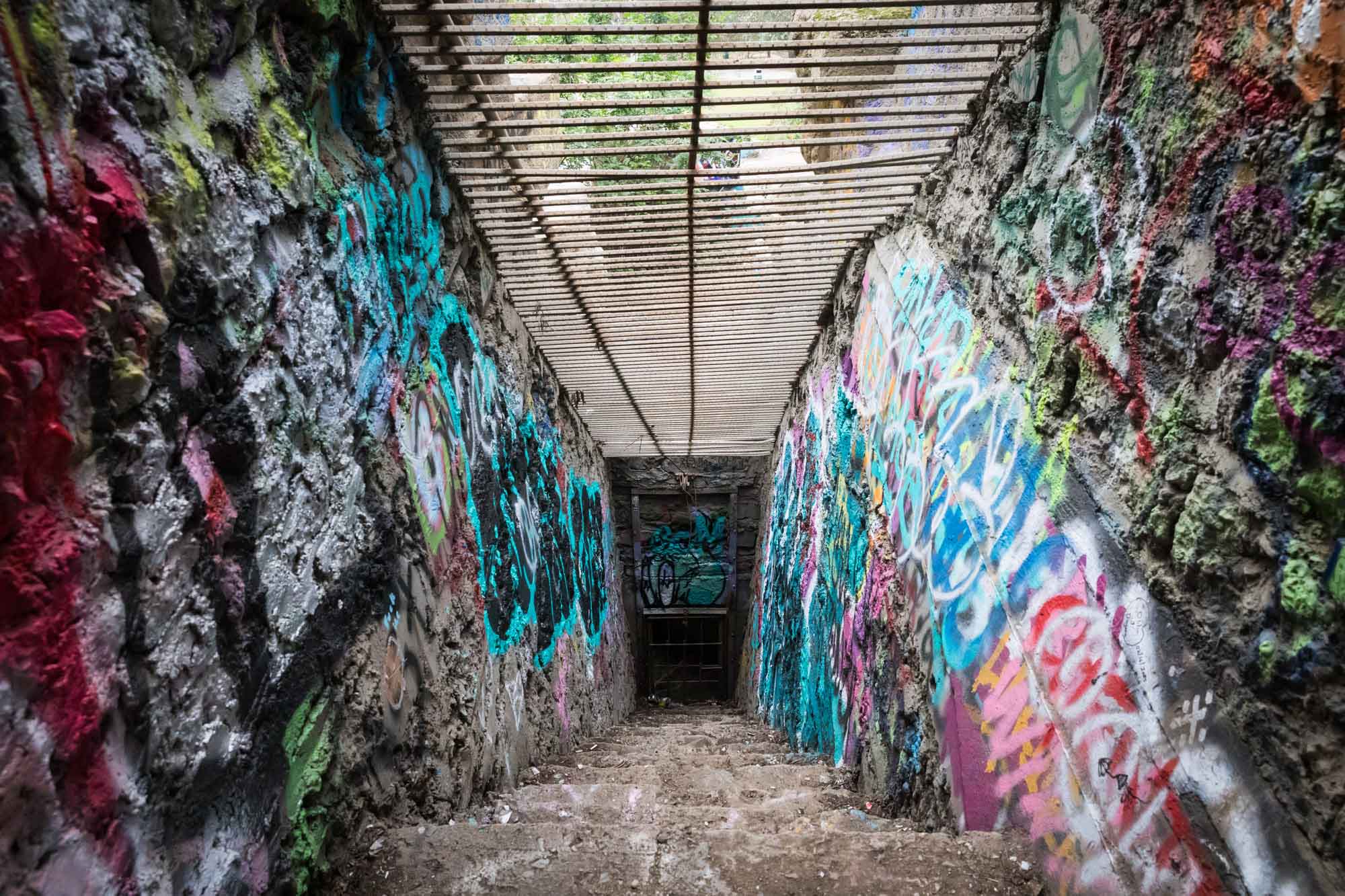 Colorful graffiti walls along stone staircase in animal enclosures of Old Los Angeles Zoo in Griffith Park for an article on where to propose at the Griffith Observatory