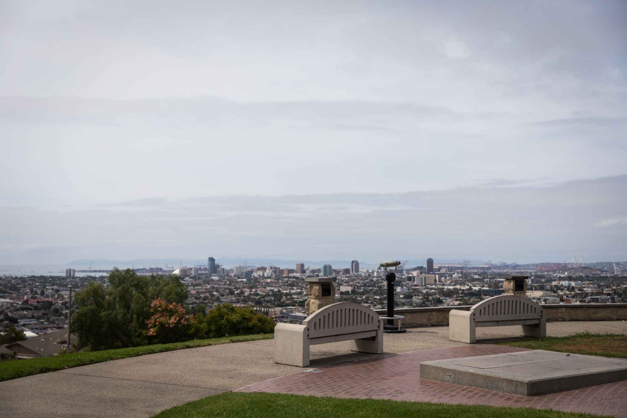 Two stone benches overlooking a view of Long Beach at Hilltop Park for an article on where to propose in Long Beach
