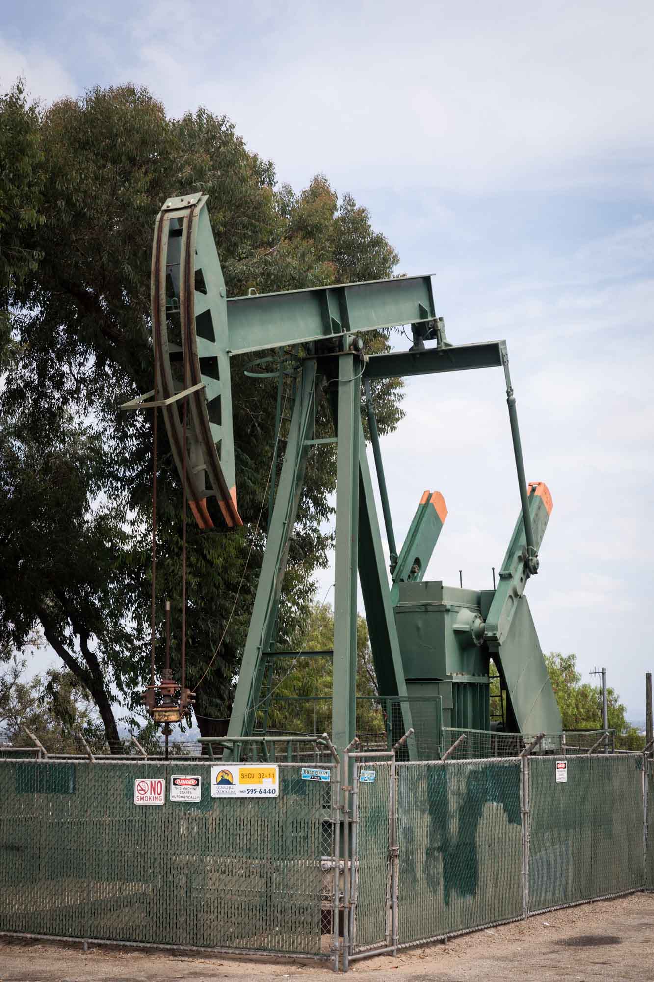 Working green oil pump at Hilltop Park for an article on where to propose in Long Beach