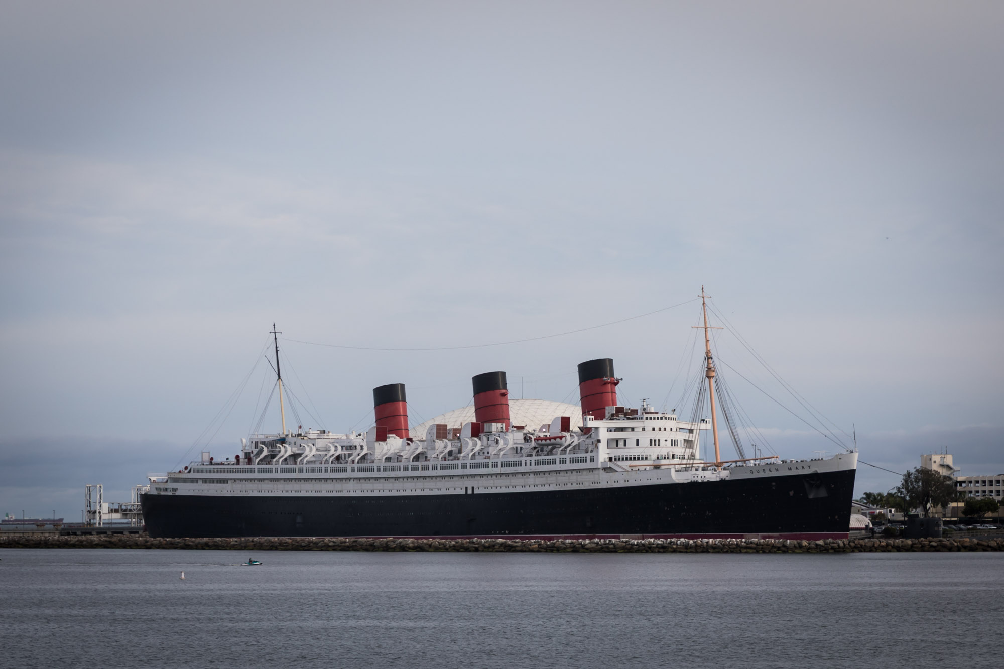 Queen Mary photo shoot location: the ocean liner docked in Long Beach harbor with three red and black funnels