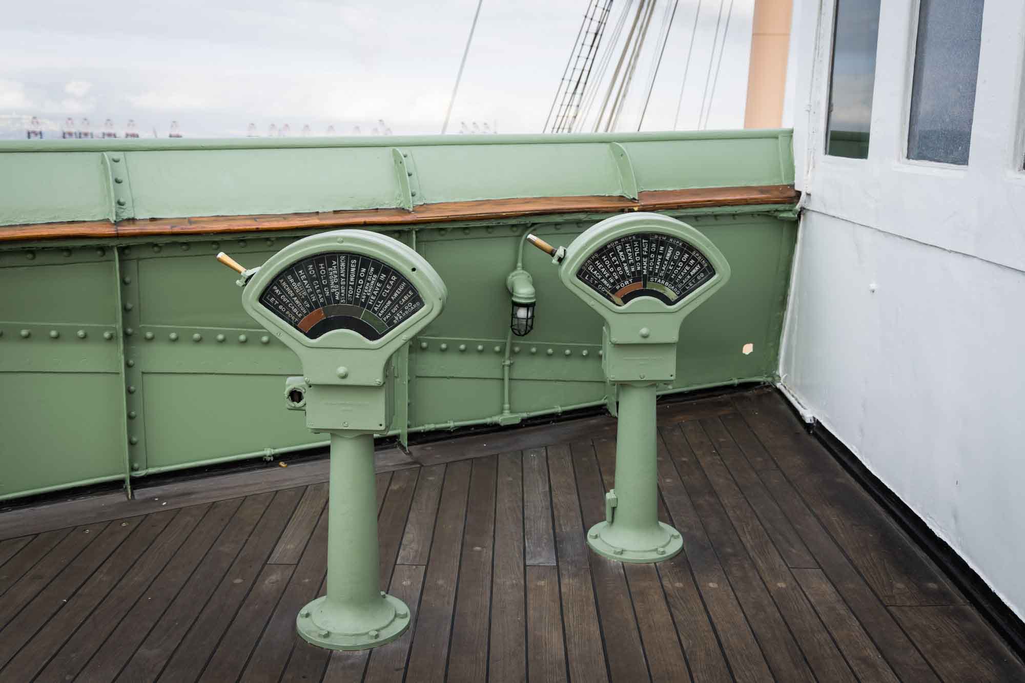 Green vintage ship telegraphs on the Bridge wing, a nautical detail for a Queen Mary photo shoot