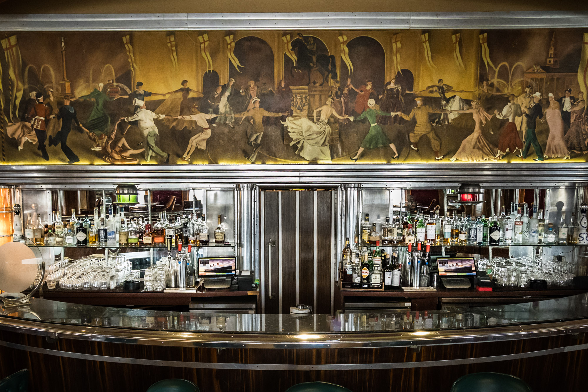 Los Angeles photographer's view of the curved Observation Bar with a dancing mural above the back bar on the Queen Mary