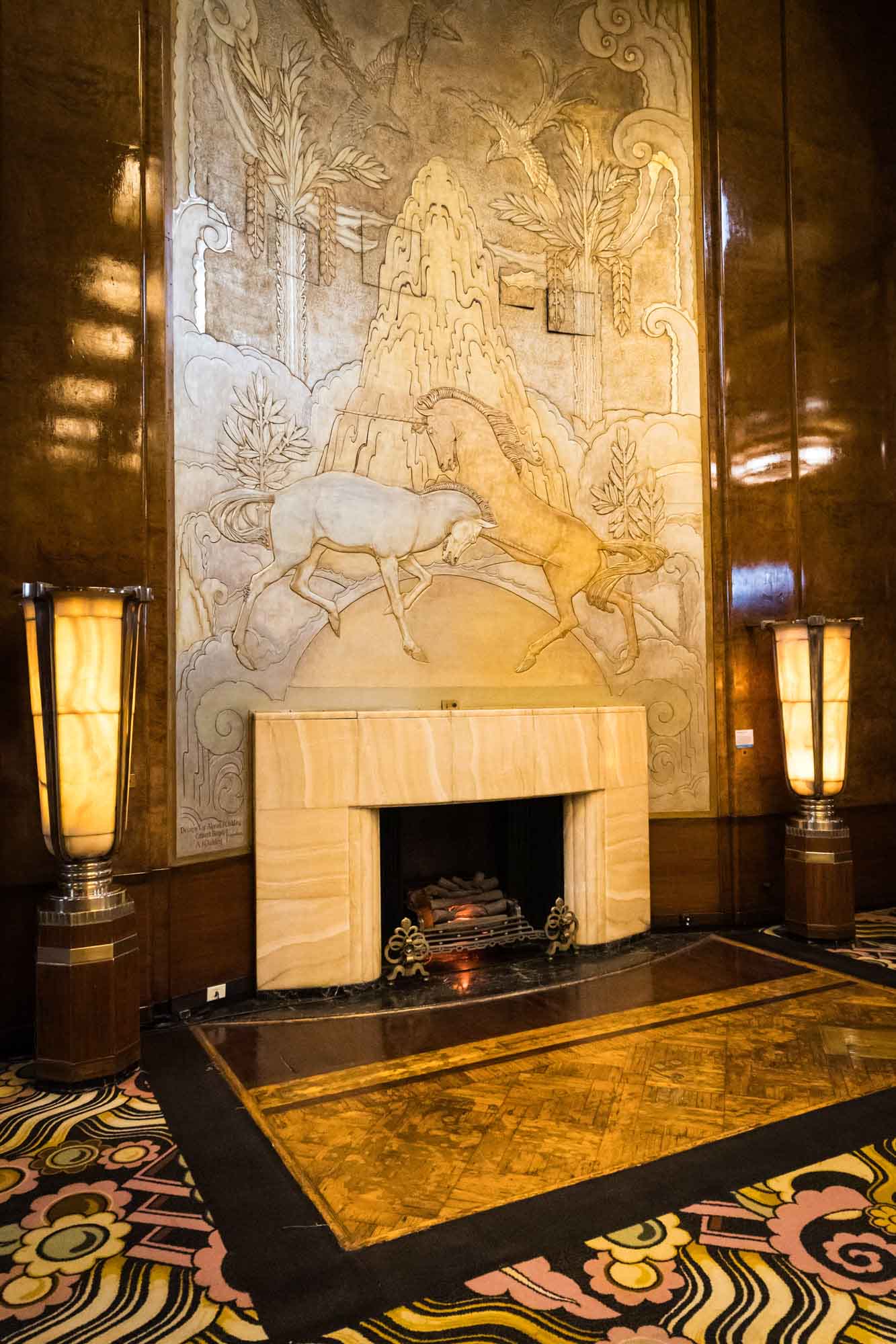 Unicorn relief panel above an onyx fireplace in the Grand Salon, an art deco backdrop for a Queen Mary photo shoot